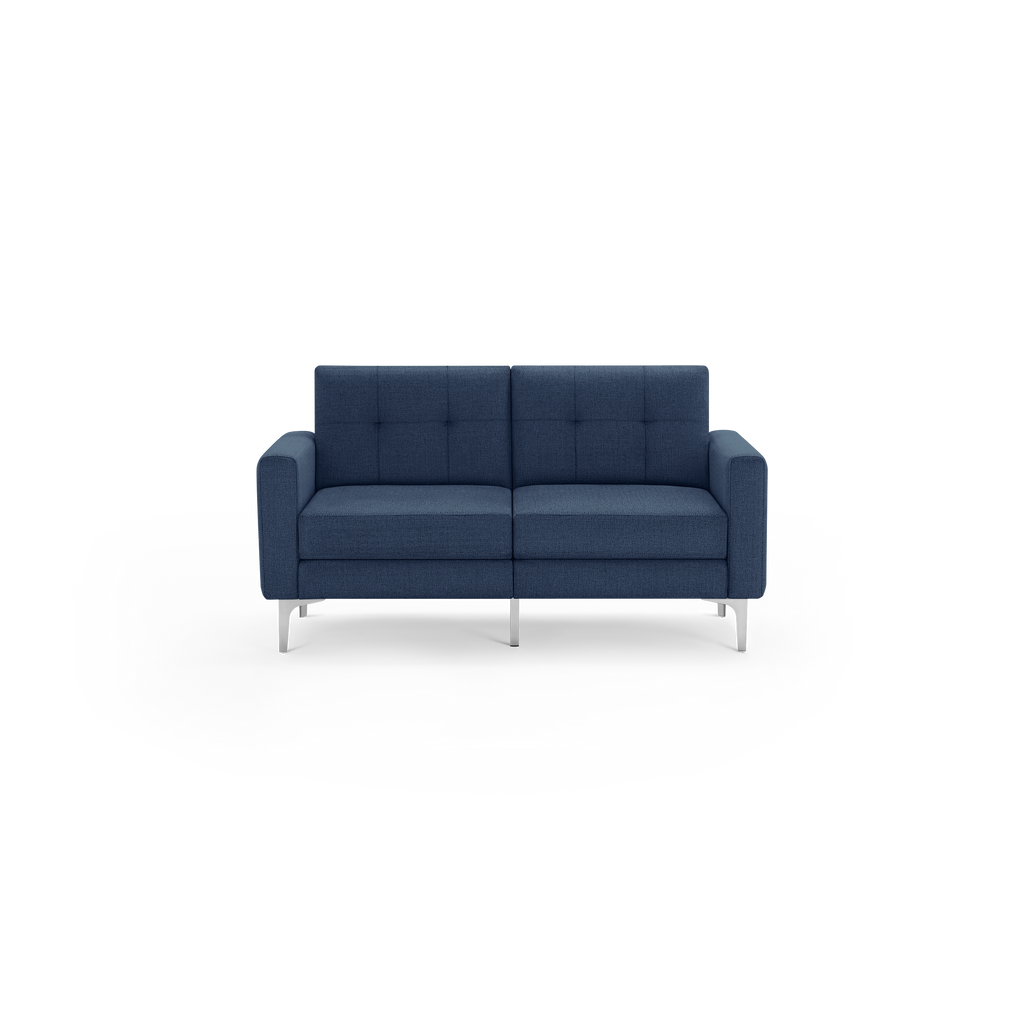 Modern two-seater sofa in dark blue fabric with tufted back cushions and sleek silver metal legs, featuring clean lines and armrests.