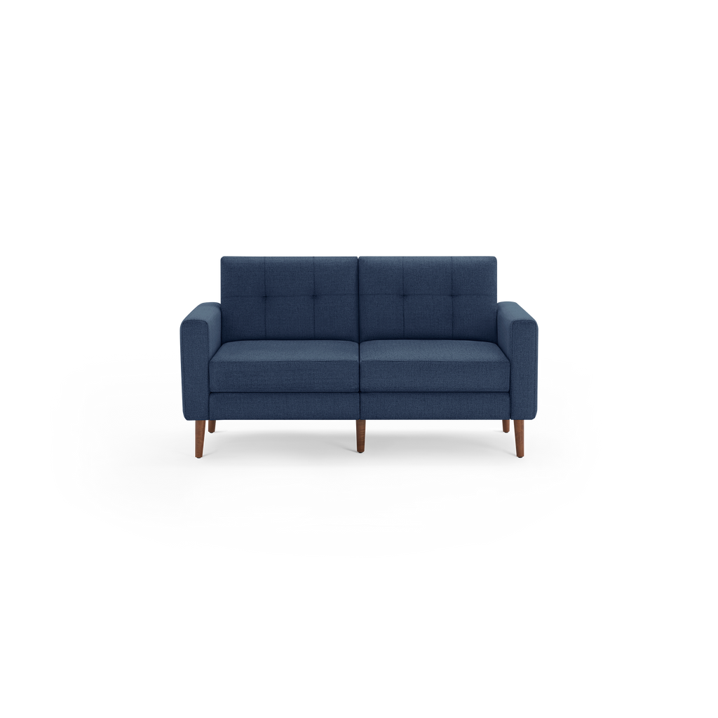 Modern navy blue fabric loveseat sofa with square tufted back cushions and wooden tapered legs.
