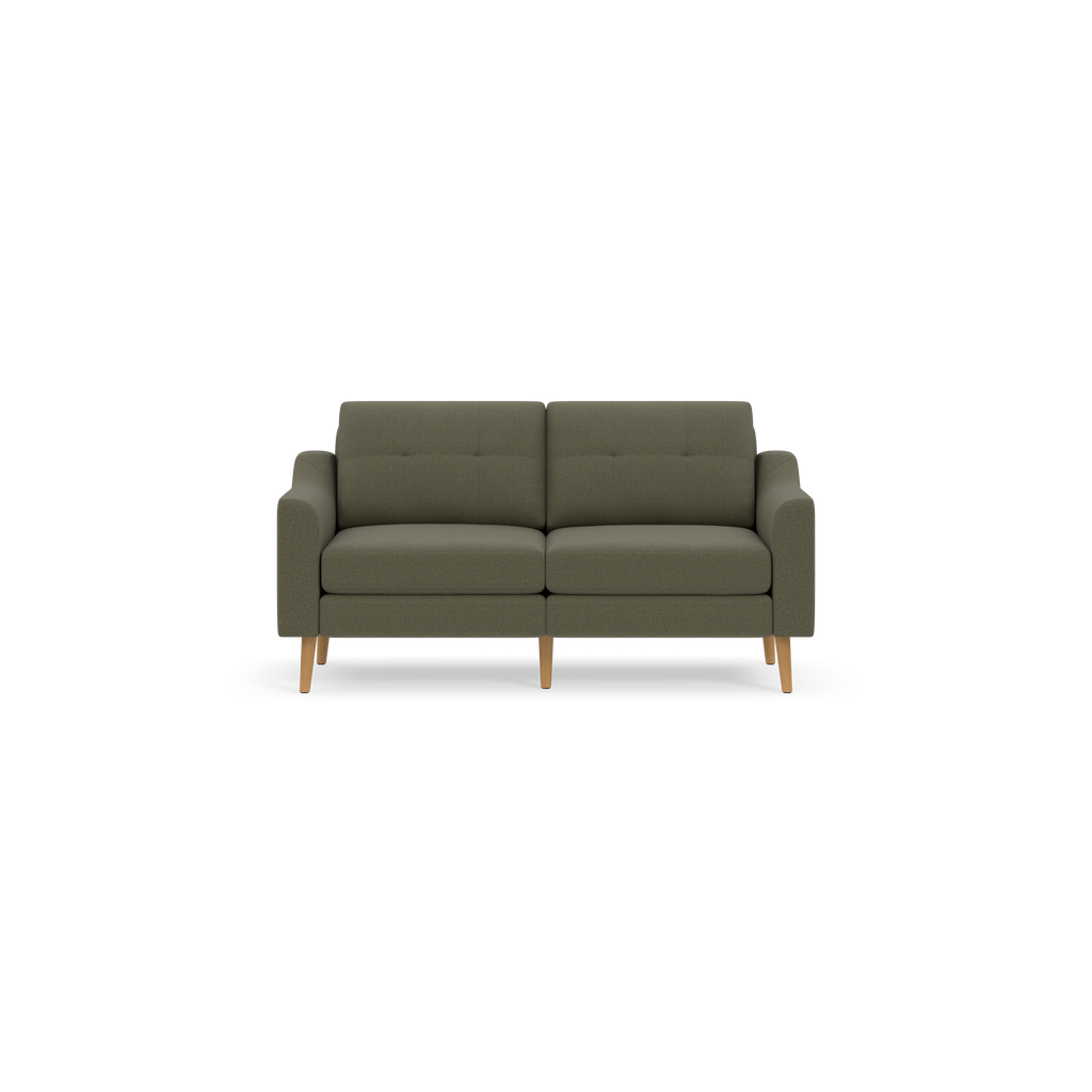 Modern Moss green two-seater sofa with wooden legs and slightly tufted back cushions against a black background.