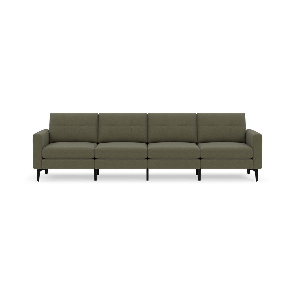 Modern Moss green four-seater sofa with tufted back cushions, padded armrests, and slim black legs against a black background.