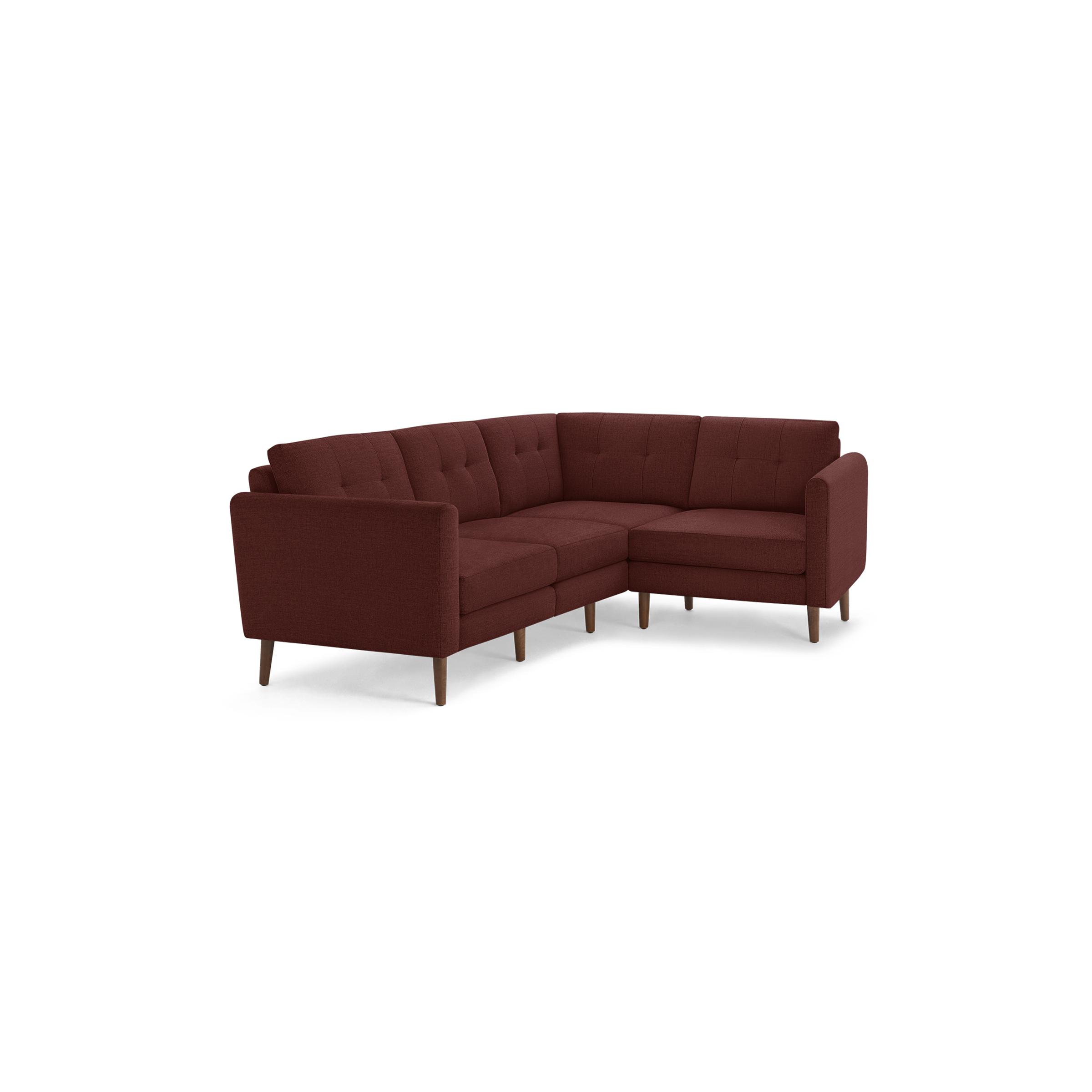 Modern L-shaped sectional sofa with tufted back cushions, upholstered in deep red fabric, supported by slender wooden legs.
