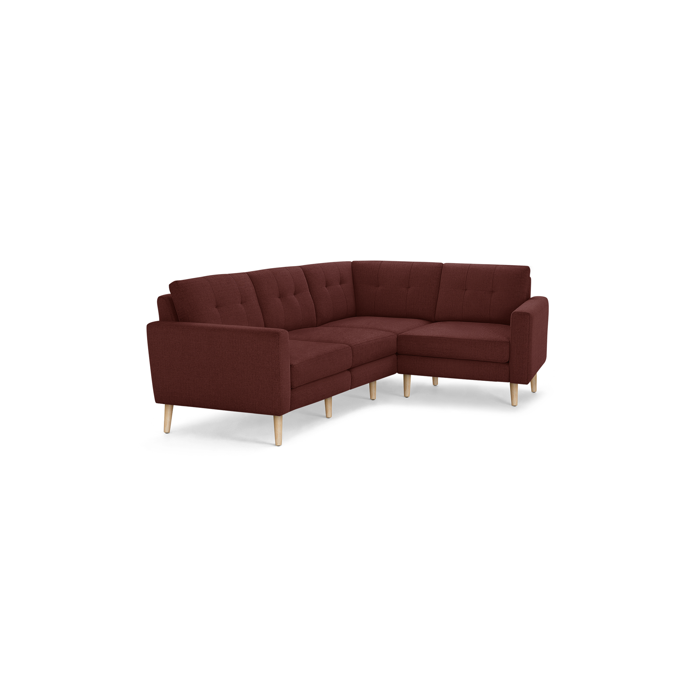 Modern L-shaped sectional sofa with tufted cushions, deep red fabric upholstery, and light wooden legs.