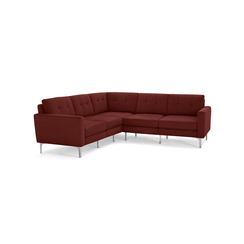 Modern L-shaped sectional sofa with deep red fabric upholstery, button-tufted back cushions, and sleek silver metal legs.