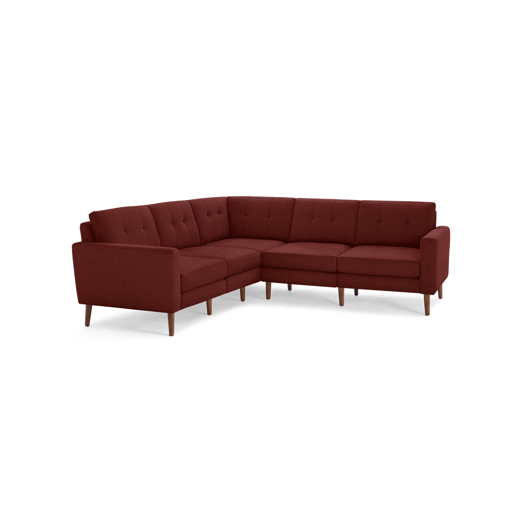 L-shaped sectional sofa in deep red fabric with tufted cushions, straight arms, and wooden legs, offering modern and cozy seating.