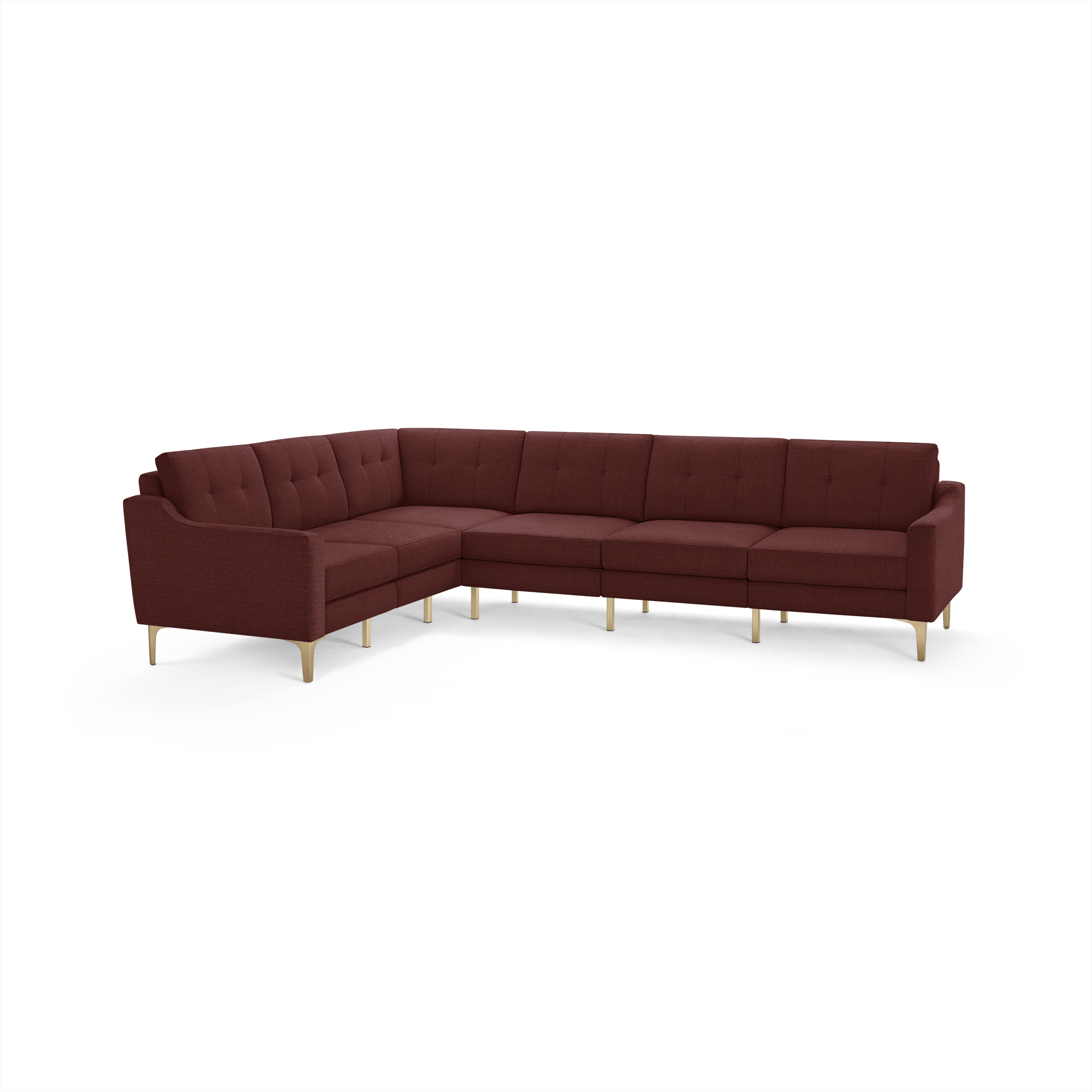 L-shaped sectional sofa in deep burgundy fabric with tufted back cushions and light wooden legs on a white background.