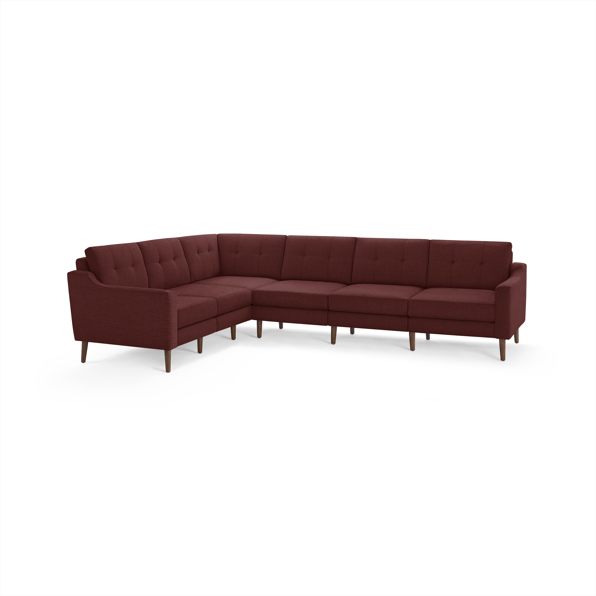 Large L-shaped sectional sofa upholstered in deep red fabric with tufted back cushions and wooden legs.
