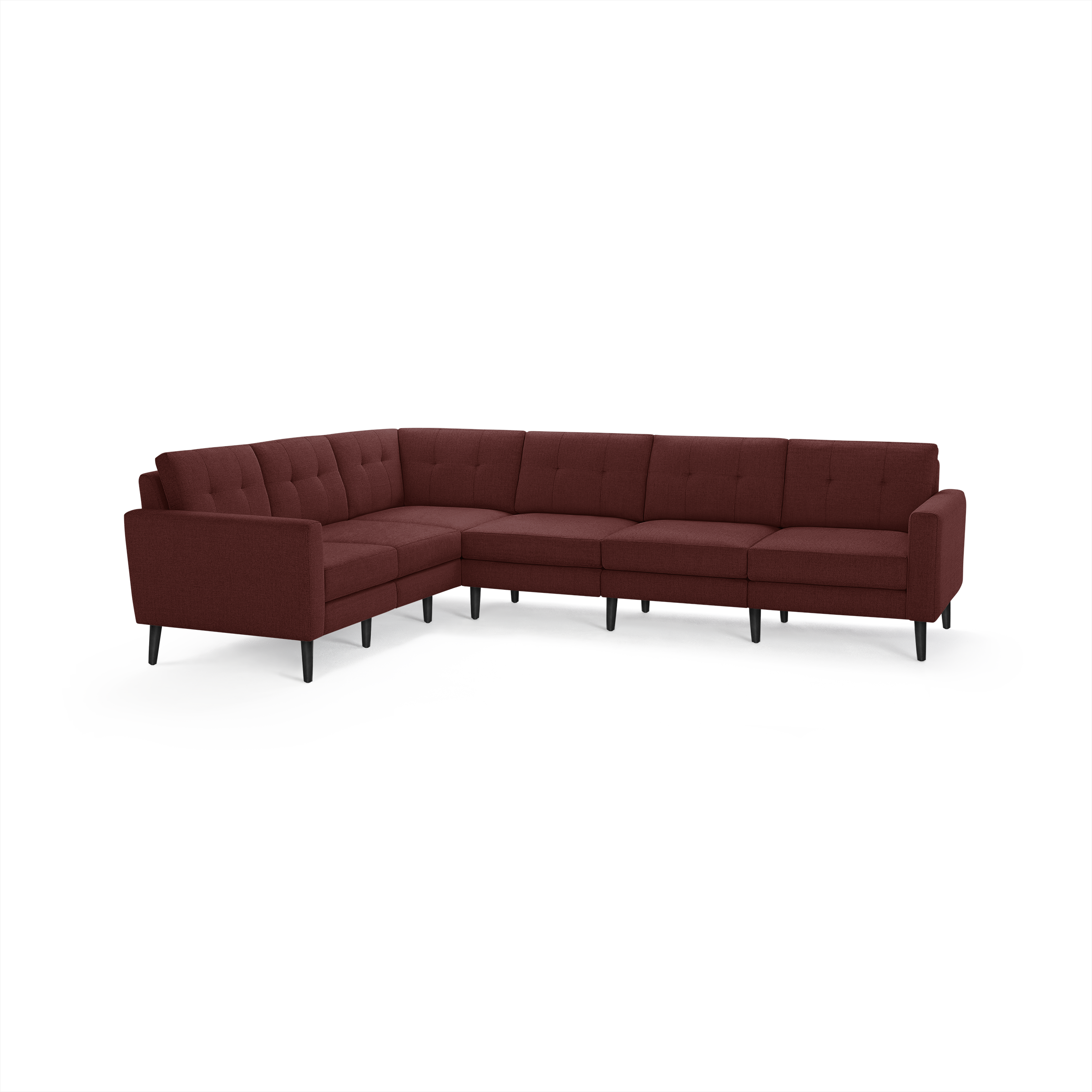 Modern L-shaped sectional sofa in deep red fabric with tufted cushions and black tapered legs, providing spacious seating.