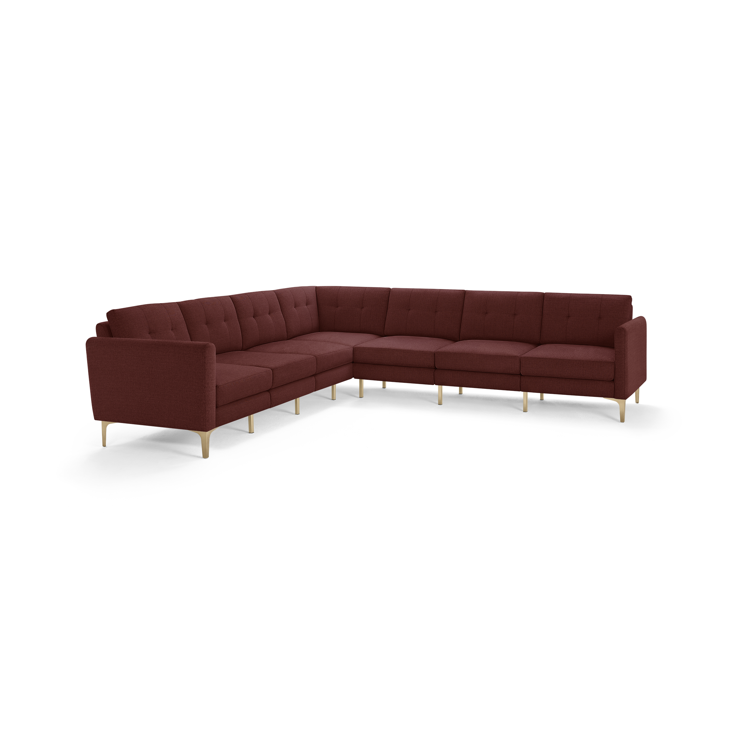Large modern L-shaped sectional sofa in deep burgundy fabric, featuring tufted back cushions and sleek wooden legs.