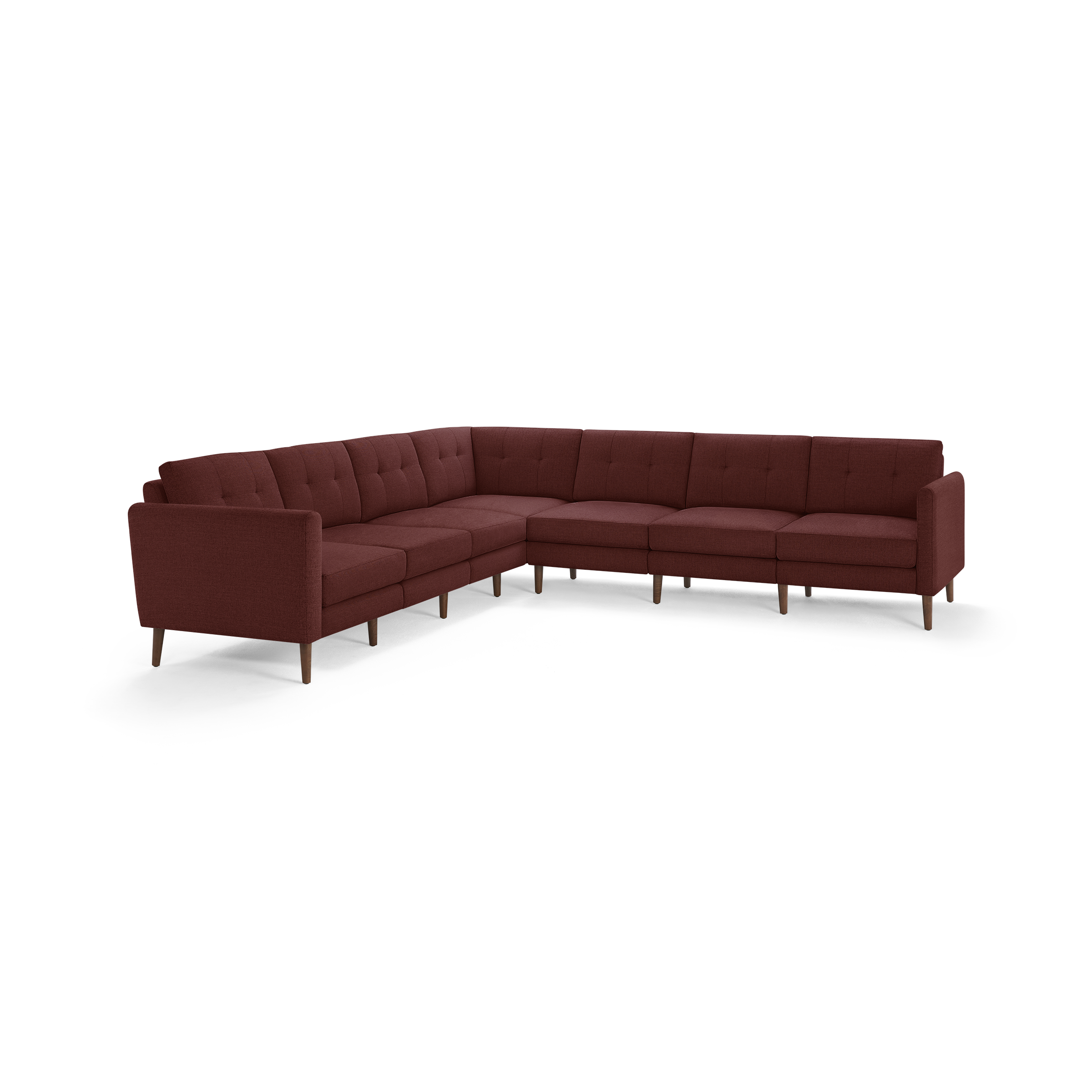 Large L-shaped sectional sofa in deep red upholstery with tufted back cushions and wooden tapered legs.