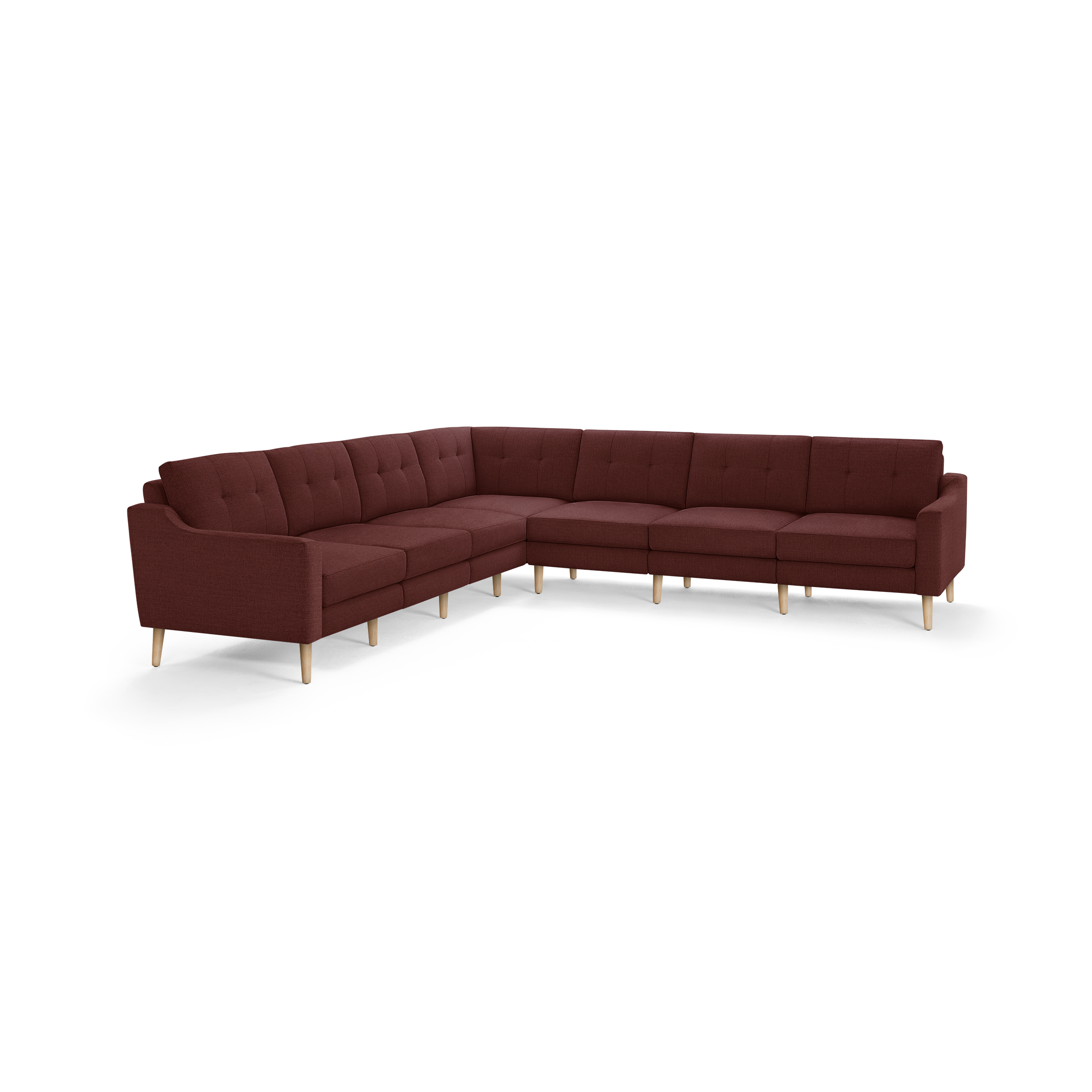 Large L-shaped sectional sofa upholstered in deep burgundy fabric with tufted cushions and light wood legs.