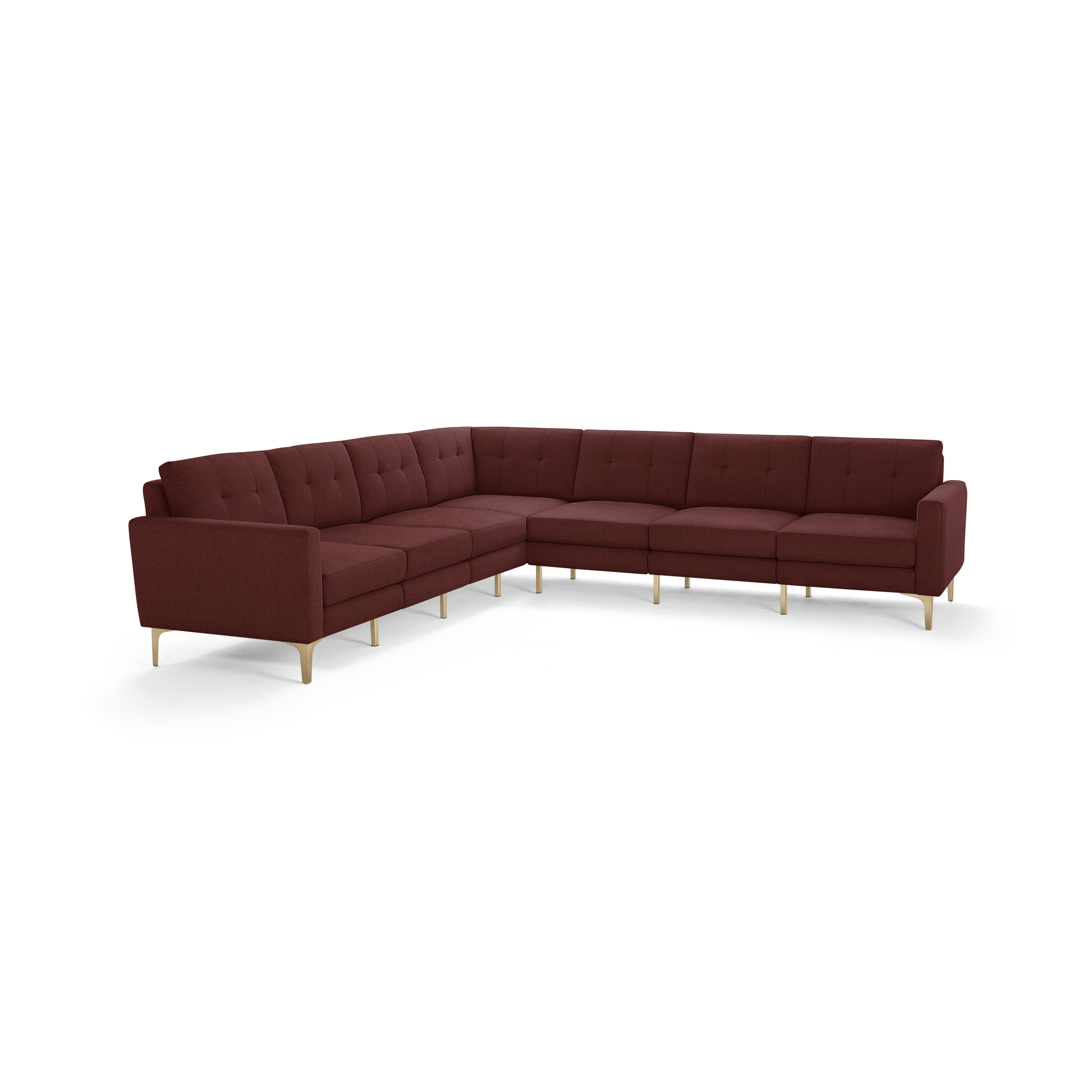 Large L-shaped sectional sofa in deep red fabric upholstery with tufted back cushions and light wooden legs.
