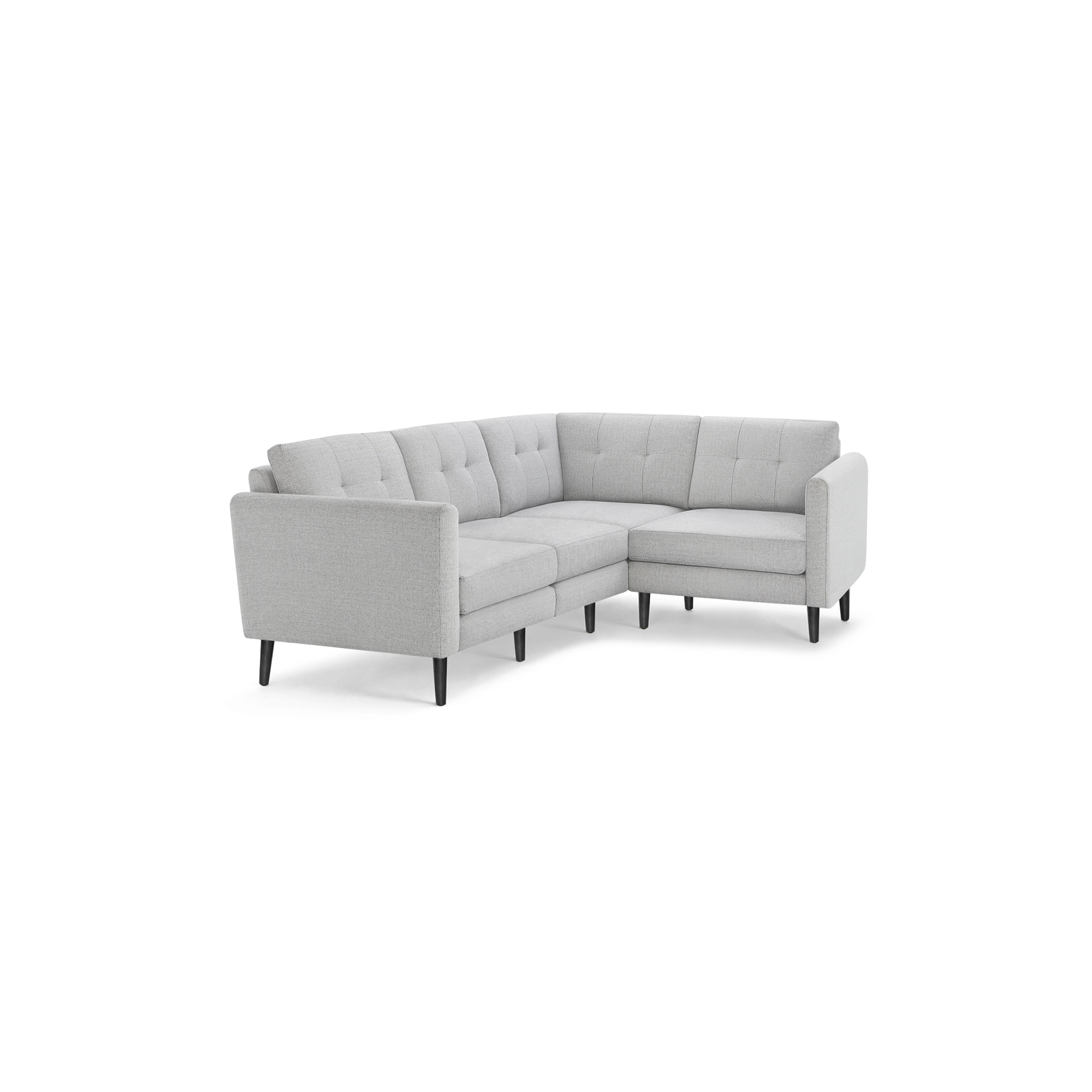 Light gray fabric mid-century modern sectional sofa with tufted back cushions and black tapered wooden legs.