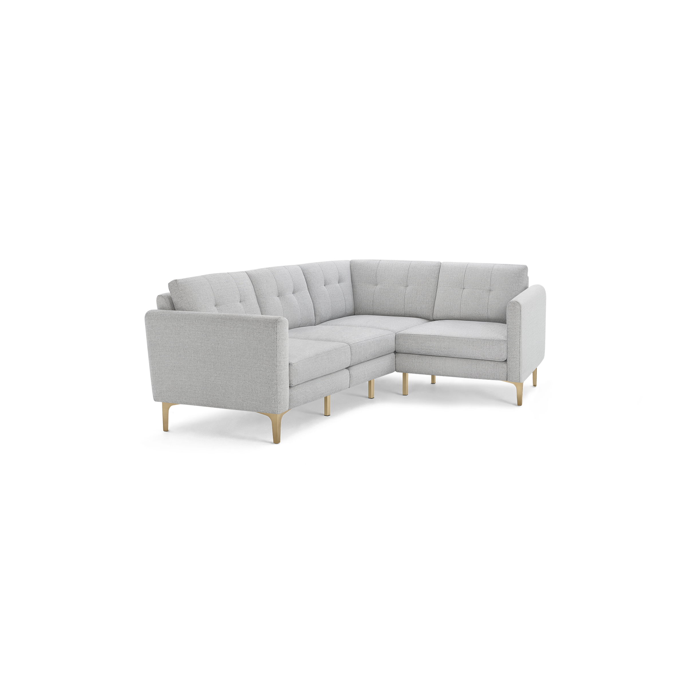 Light gray upholstered L-shaped sectional sofa with tufted back cushions and light wooden legs, modern minimalist design.