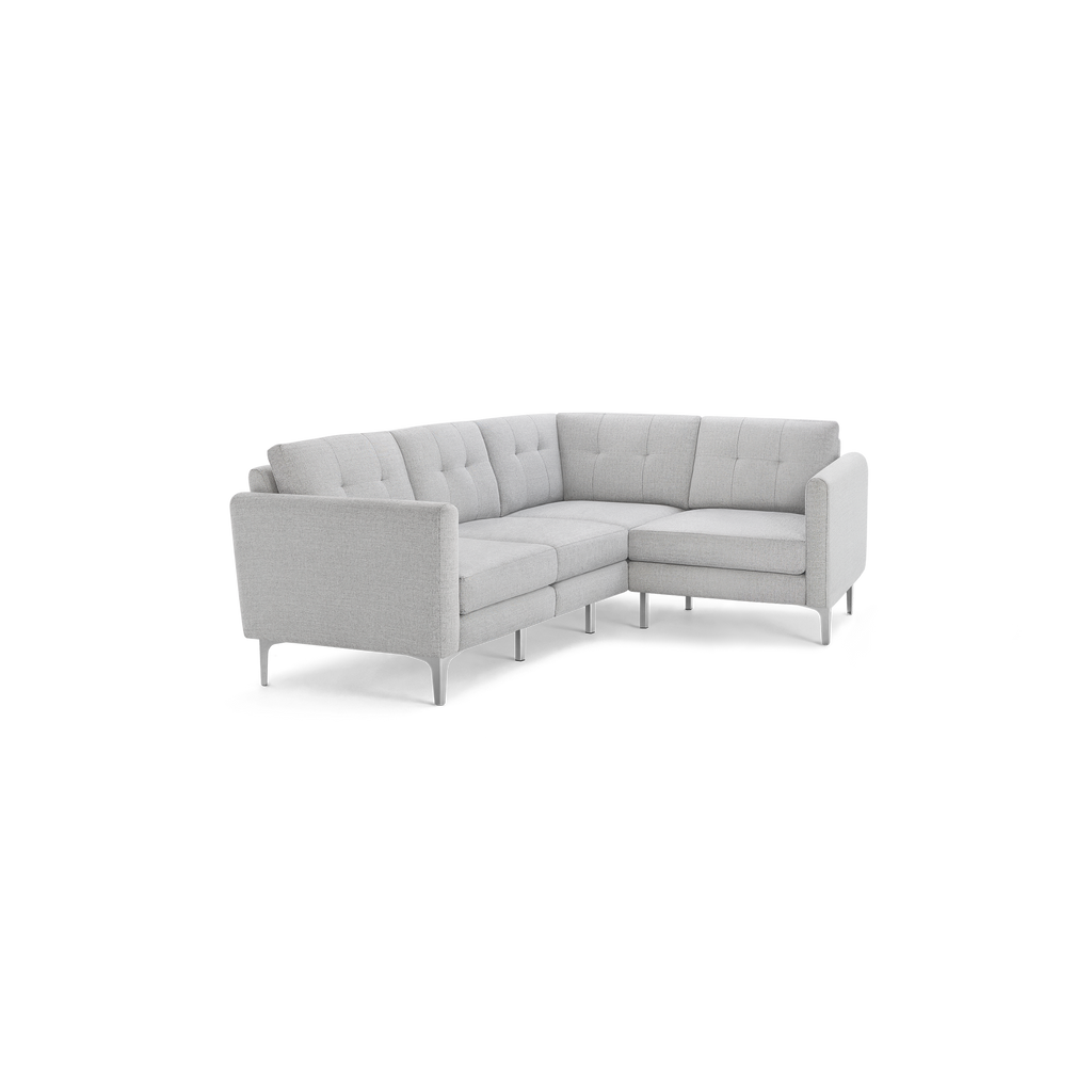 Light gray modern sectional sofa with tufted back cushions, clean lines, and slim metal legs, designed for corner seating.