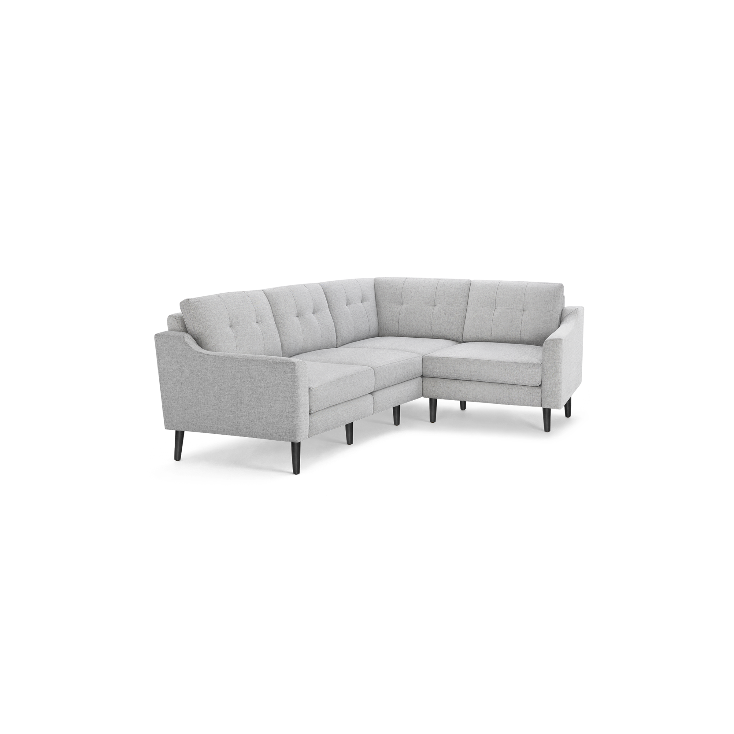 Light gray upholstered L-shaped sectional sofa with tufted back cushions and black wooden legs.