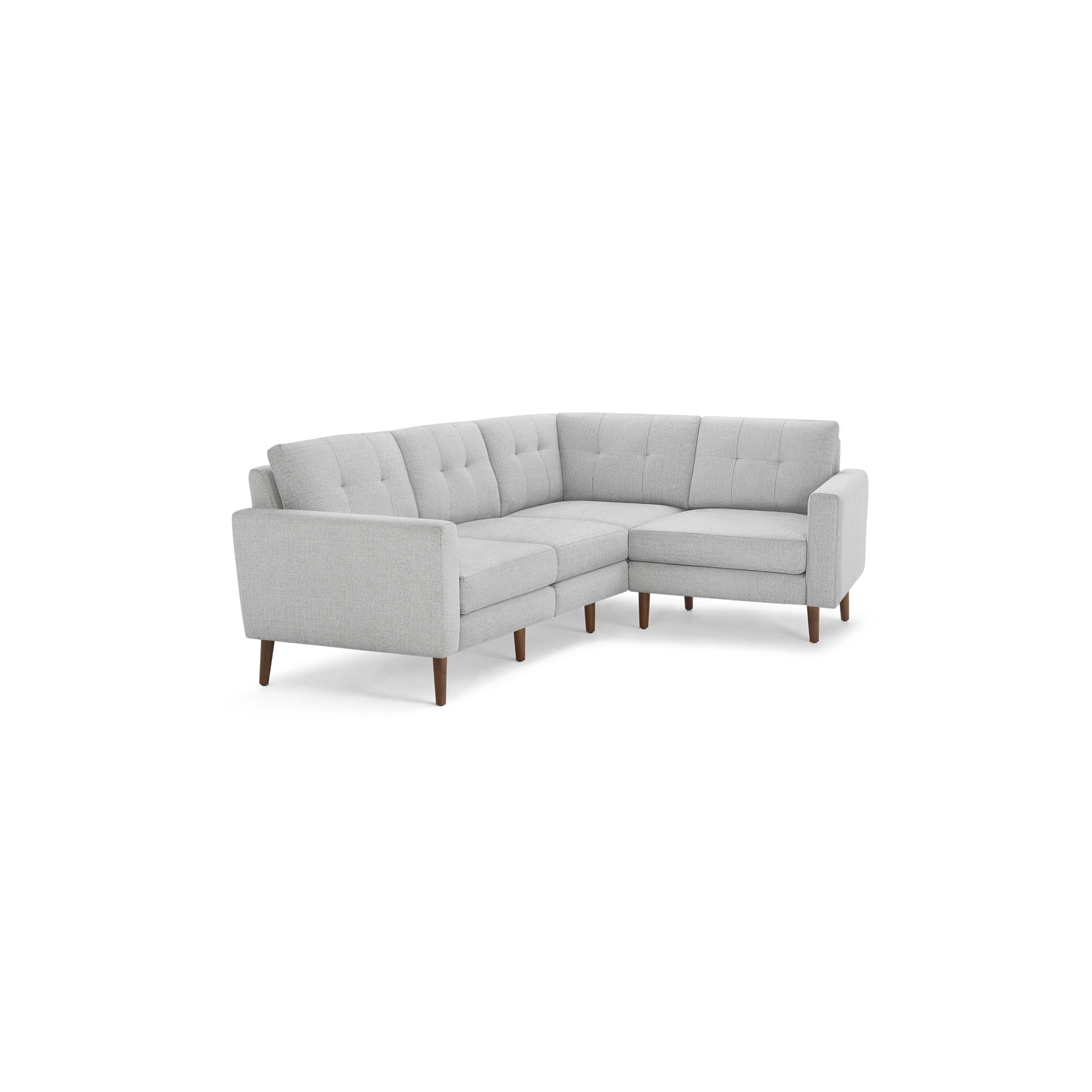 Light gray fabric upholstered sectional sofa with tufted back cushions and wooden legs, designed for corner placement.