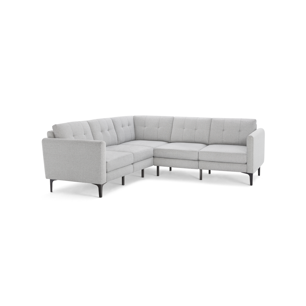 Light gray modern L-shaped sectional sofa with tufted back cushions and slim black legs, designed for corner placement.