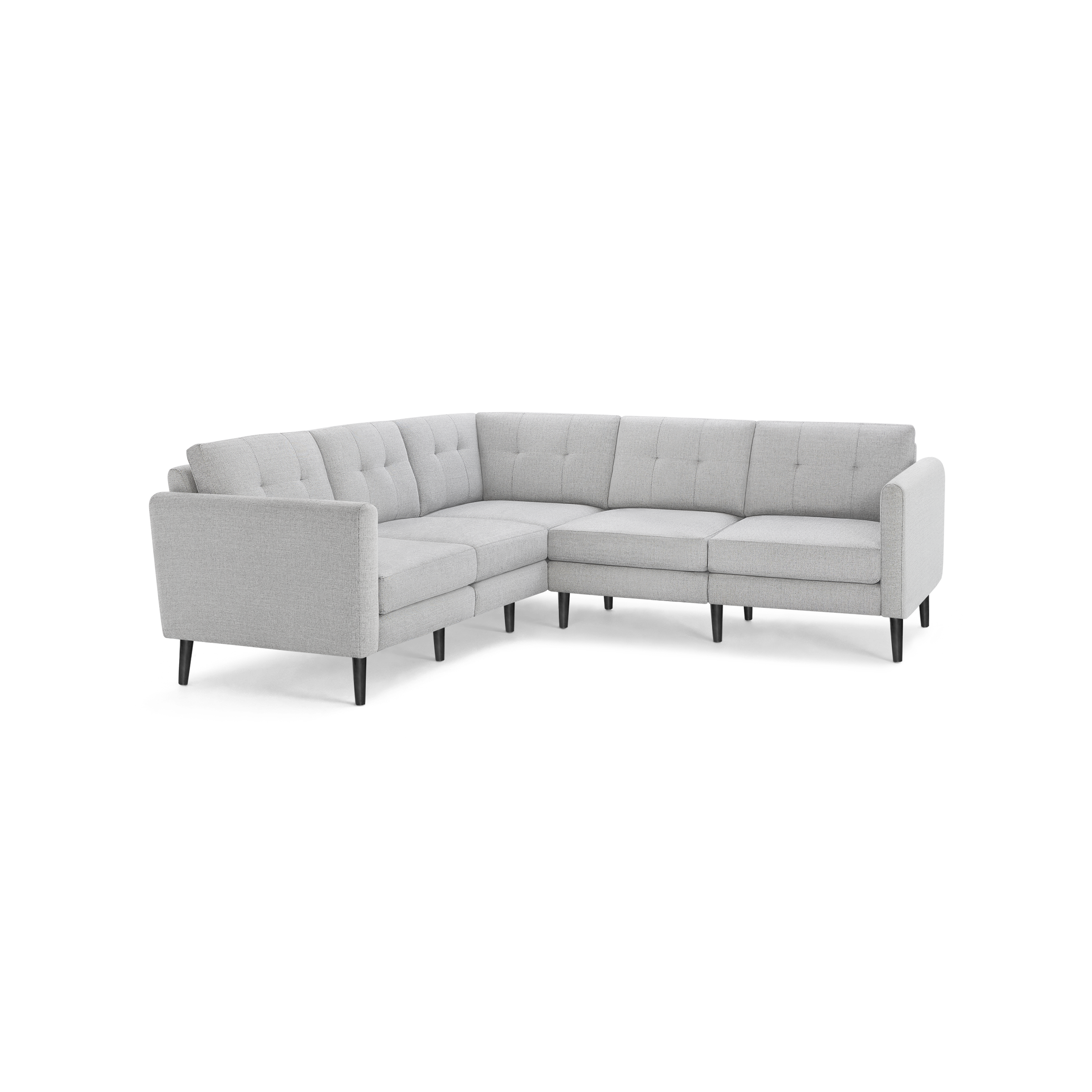 Light gray L-shaped sectional sofa with tufted cushions and black wooden legs on a black background.