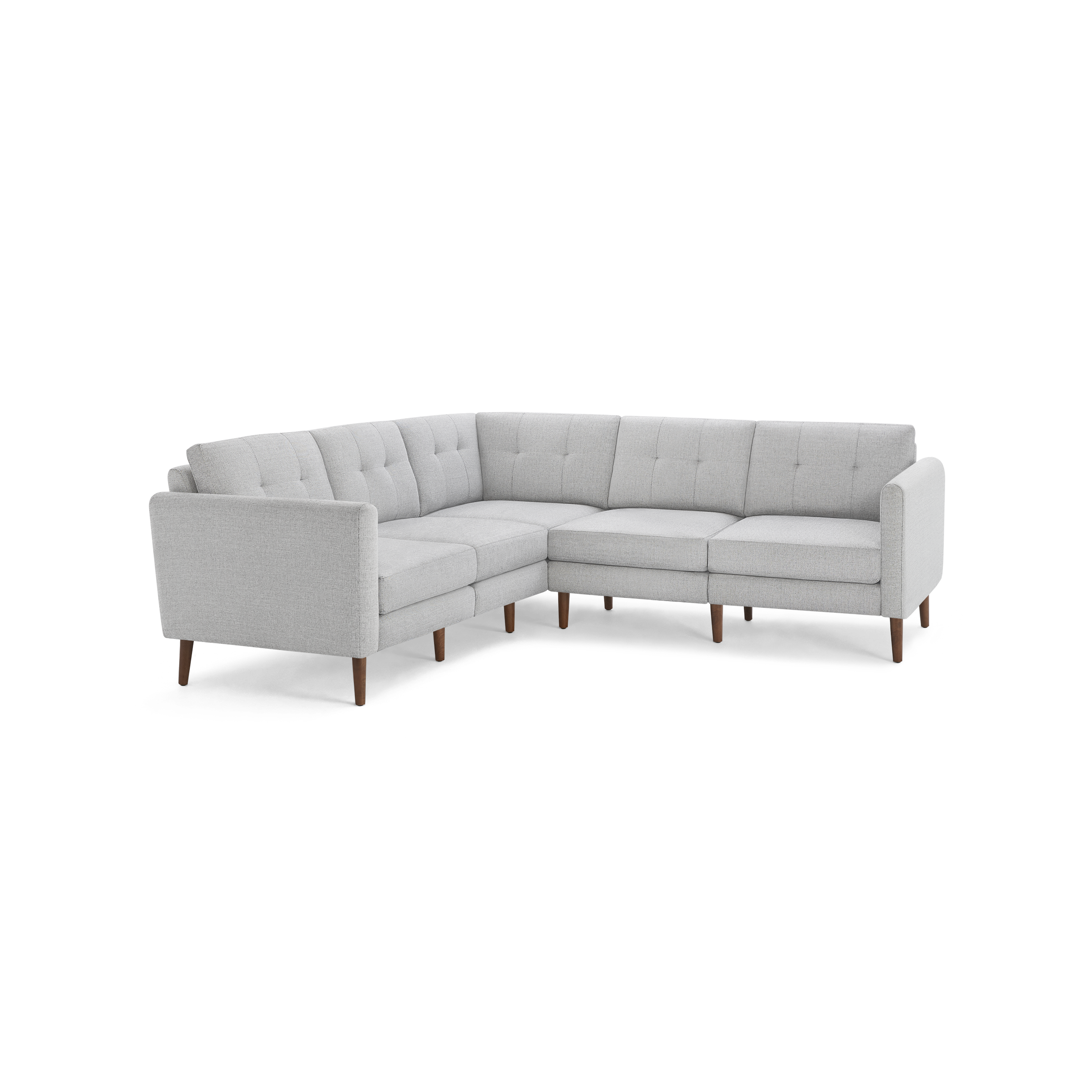 Light gray fabric sectional sofa with tufted back cushions and wooden legs, designed in an L-shape for corner seating.