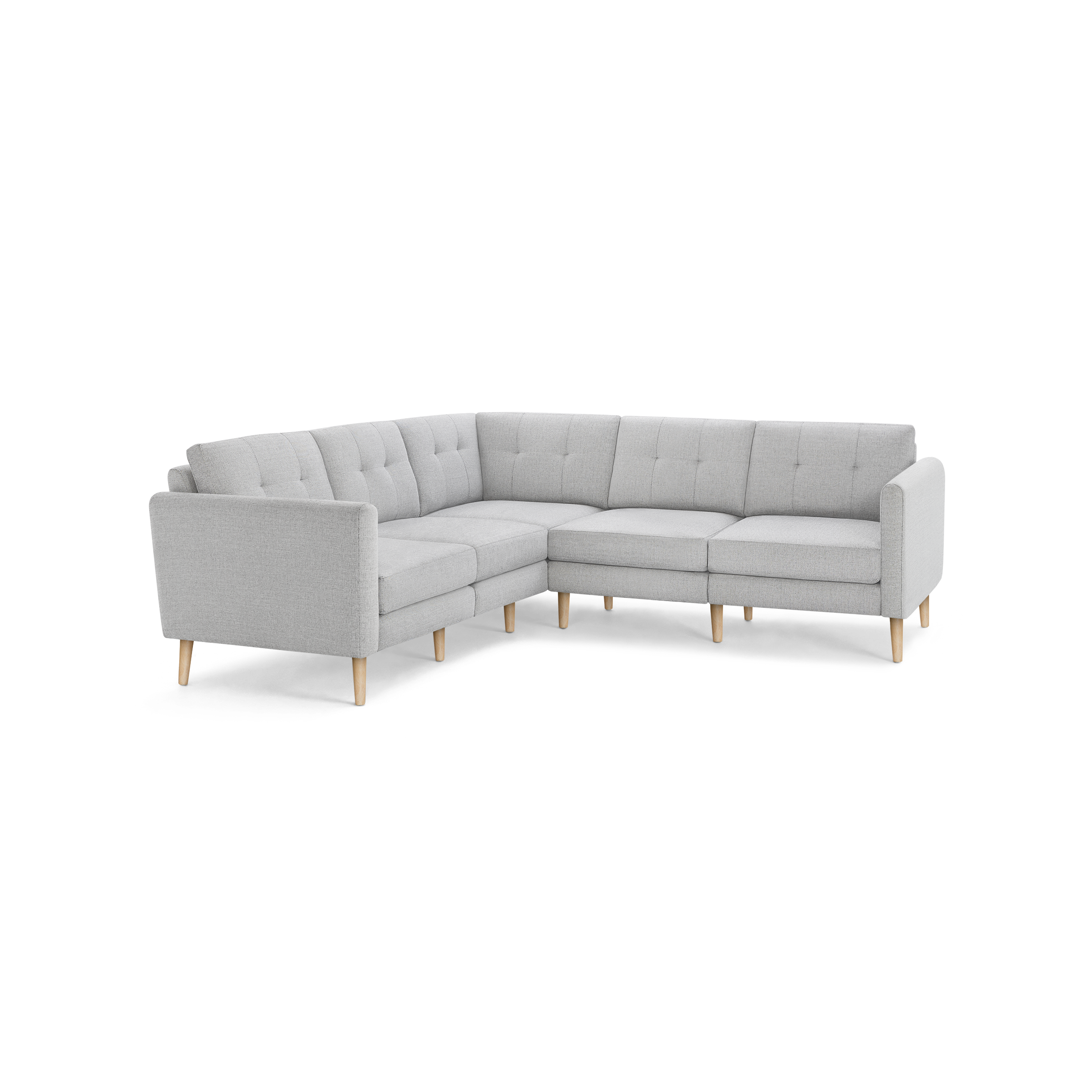 Light gray L-shaped sectional sofa with tufted back cushions and wooden tapered legs.