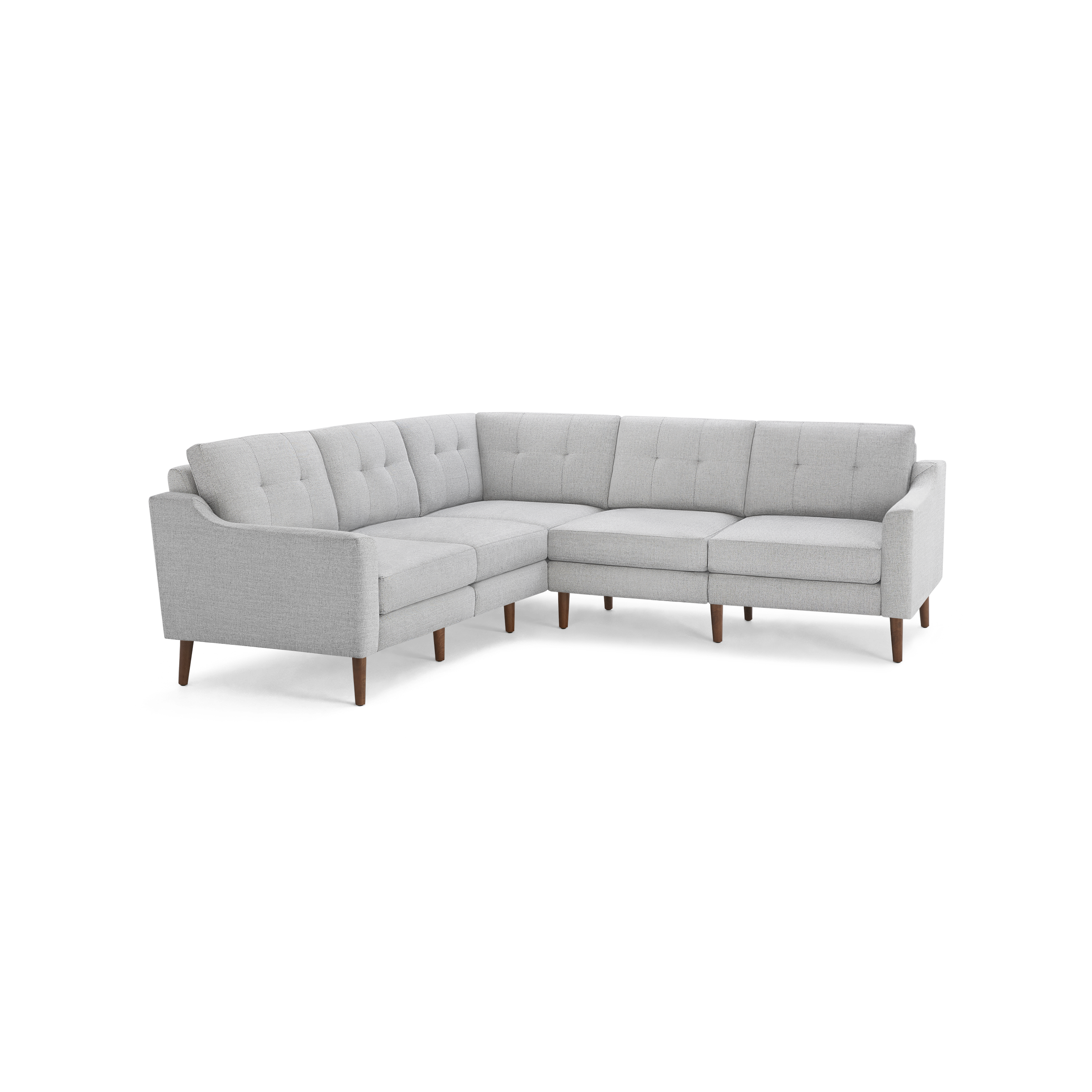 Light gray fabric L-shaped sectional sofa with tufted back cushions and wooden tapered legs.