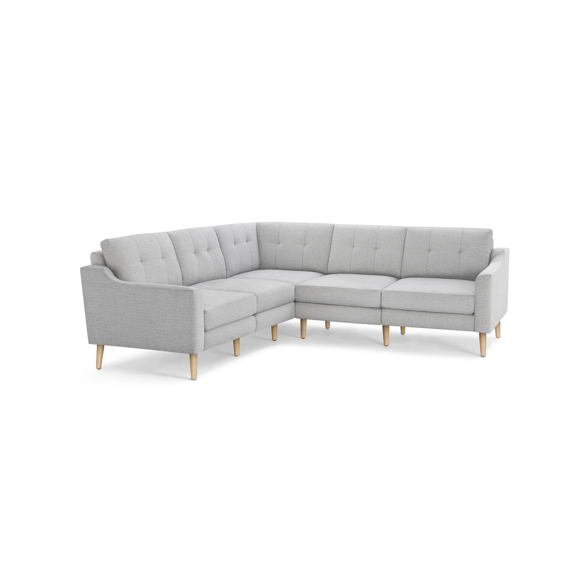 Light gray L-shaped sectional sofa with tufted back cushions and natural wood legs, modern and minimalist design.