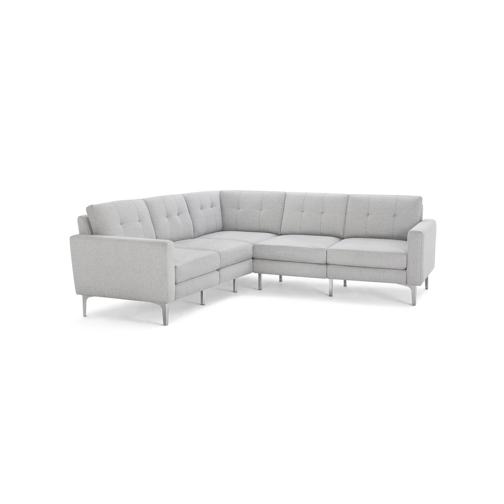 Light gray L-shaped sectional sofa with tufted back cushions and slim metal legs, offering modern and spacious seating.