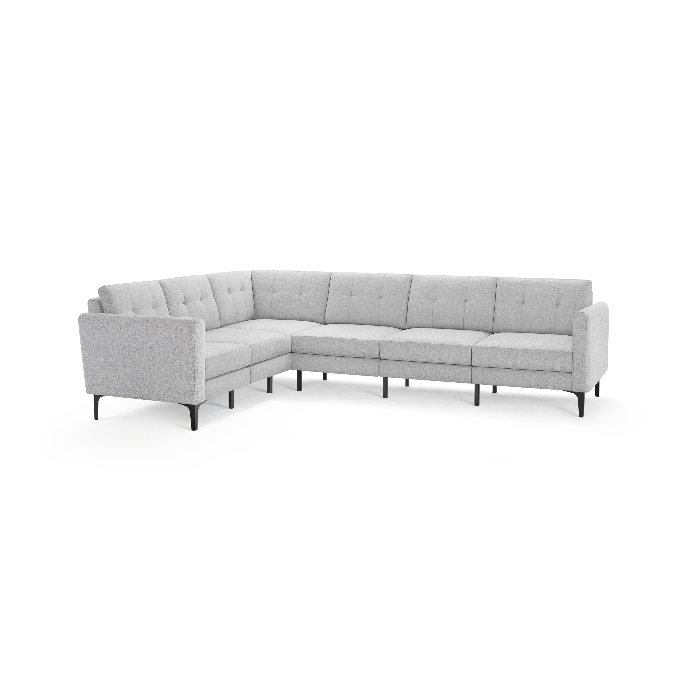 Light gray L-shaped sectional sofa with tufted back cushions and slim black legs, modern mid-century design.
