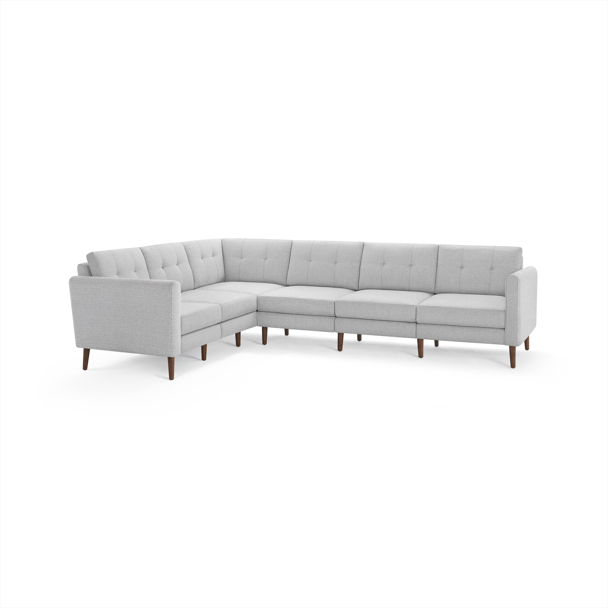 Light gray L-shaped sectional sofa with tufted back cushions and wooden legs, designed for modern living spaces.