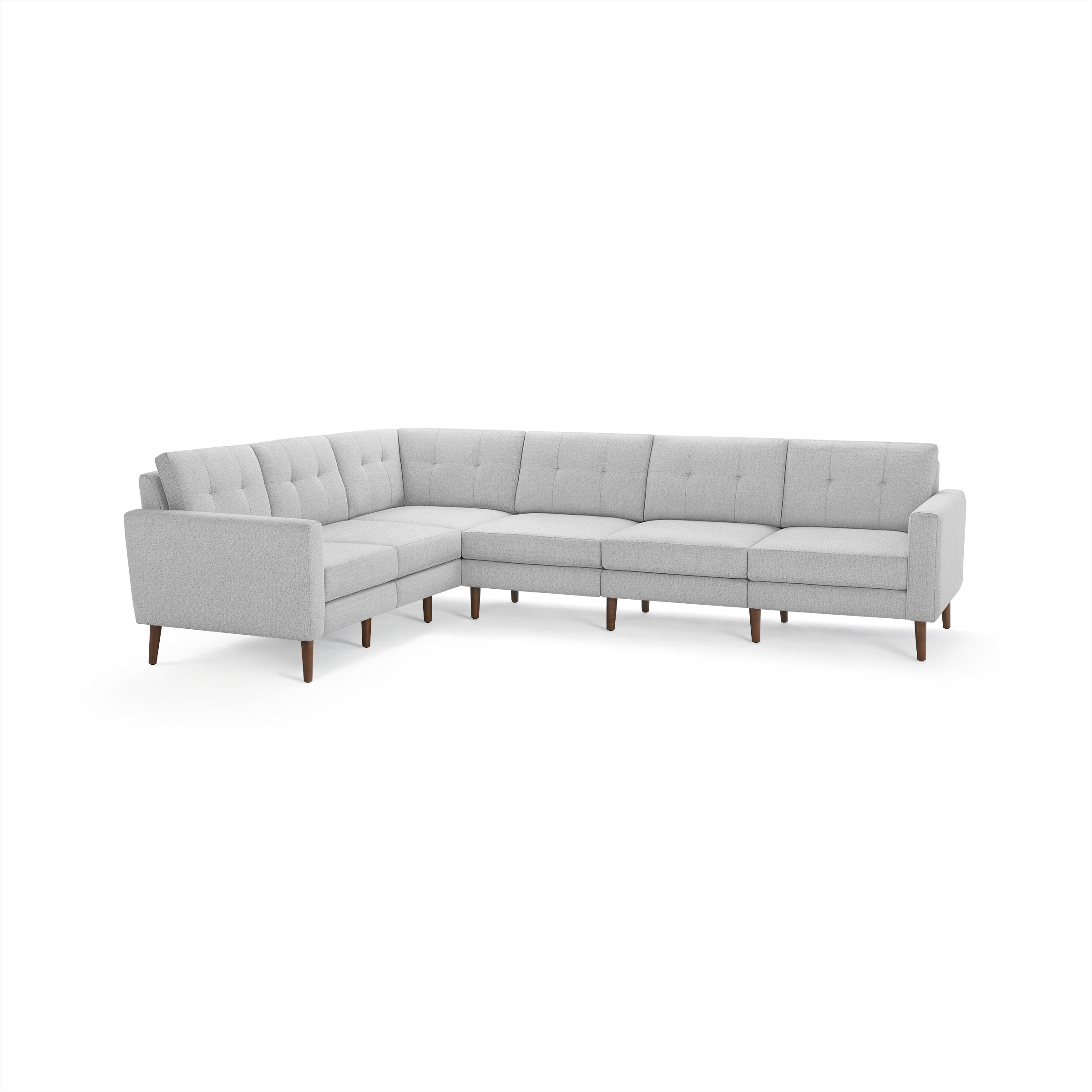 Light gray L-shaped sectional sofa with tufted back cushions and wooden legs, showcasing modern and minimalist design.