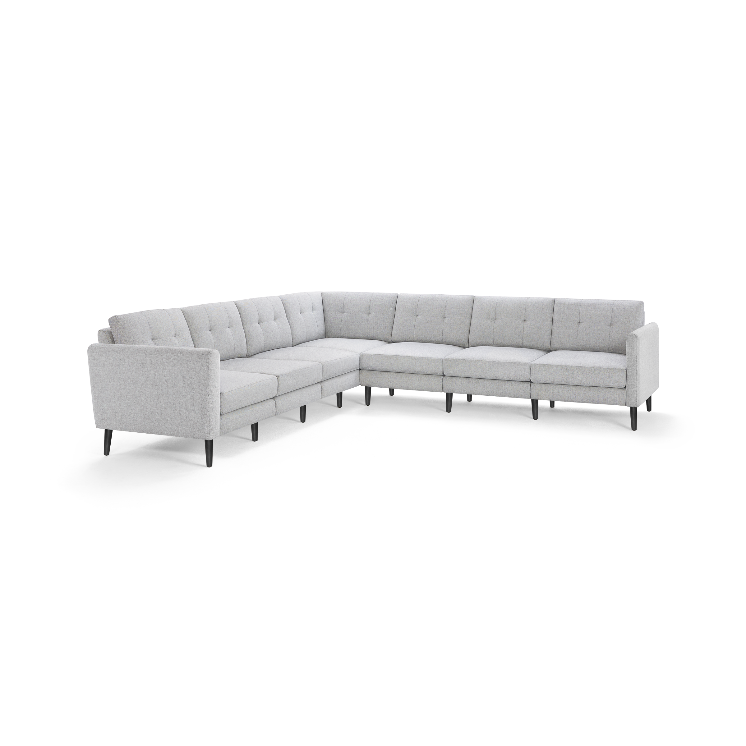 Light gray L-shaped sectional sofa with tufted back cushions, slim armrests, and dark tapered wooden legs.