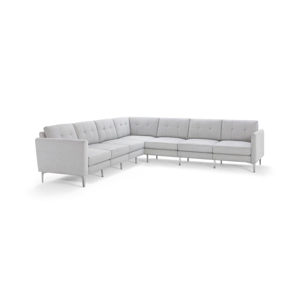 Light gray modern L-shaped sectional sofa with tufted cushions and slim metal legs on a white background.