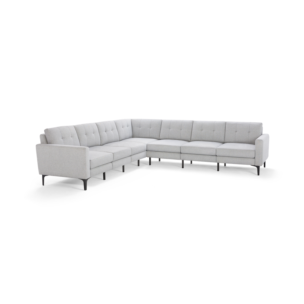 Light gray L-shaped sectional sofa with tufted cushions, slim black legs, and clean modern design.
