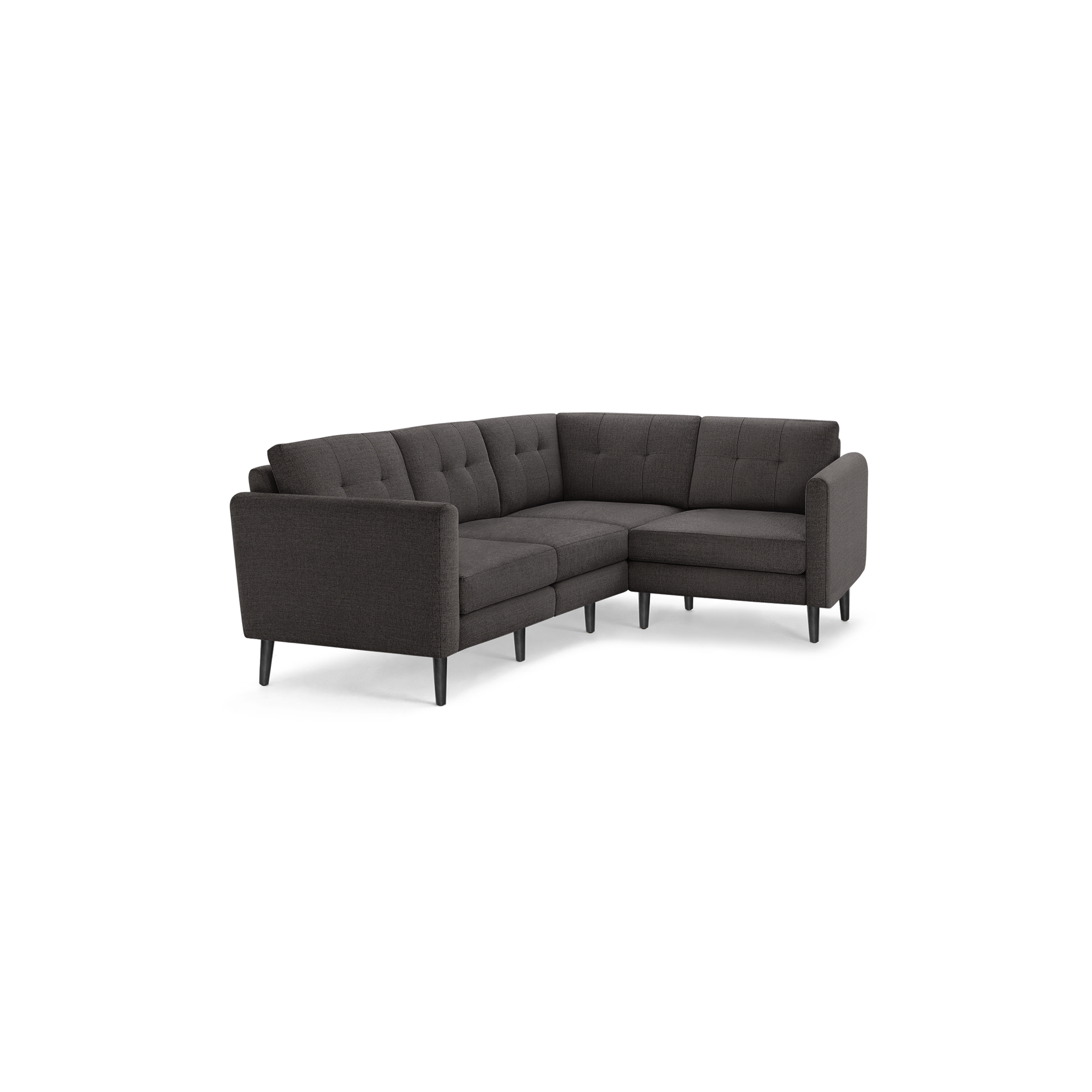 Dark gray fabric L-shaped sectional sofa with tufted back cushions and slim black wooden legs.