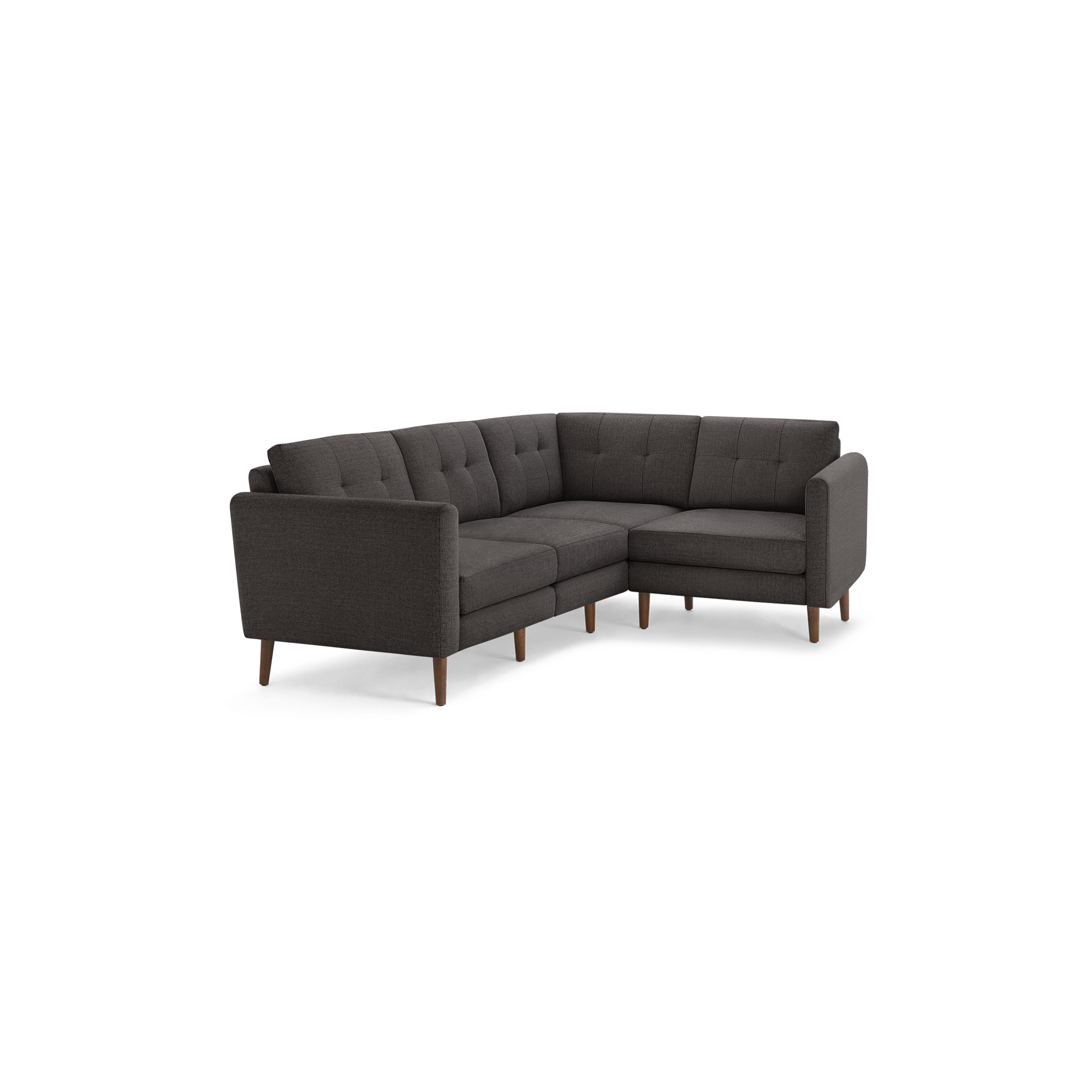 Dark gray L-shaped sectional sofa with tufted back cushions, wooden legs, and modern mid-century design.