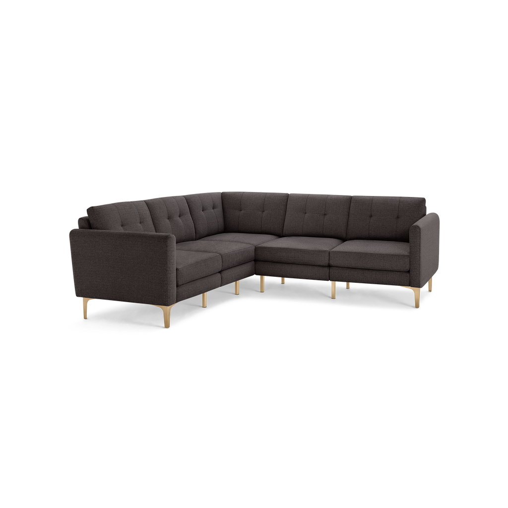 Modern L-shaped sectional sofa with dark gray tufted fabric upholstery and light wooden legs, designed for living room comfort and style.