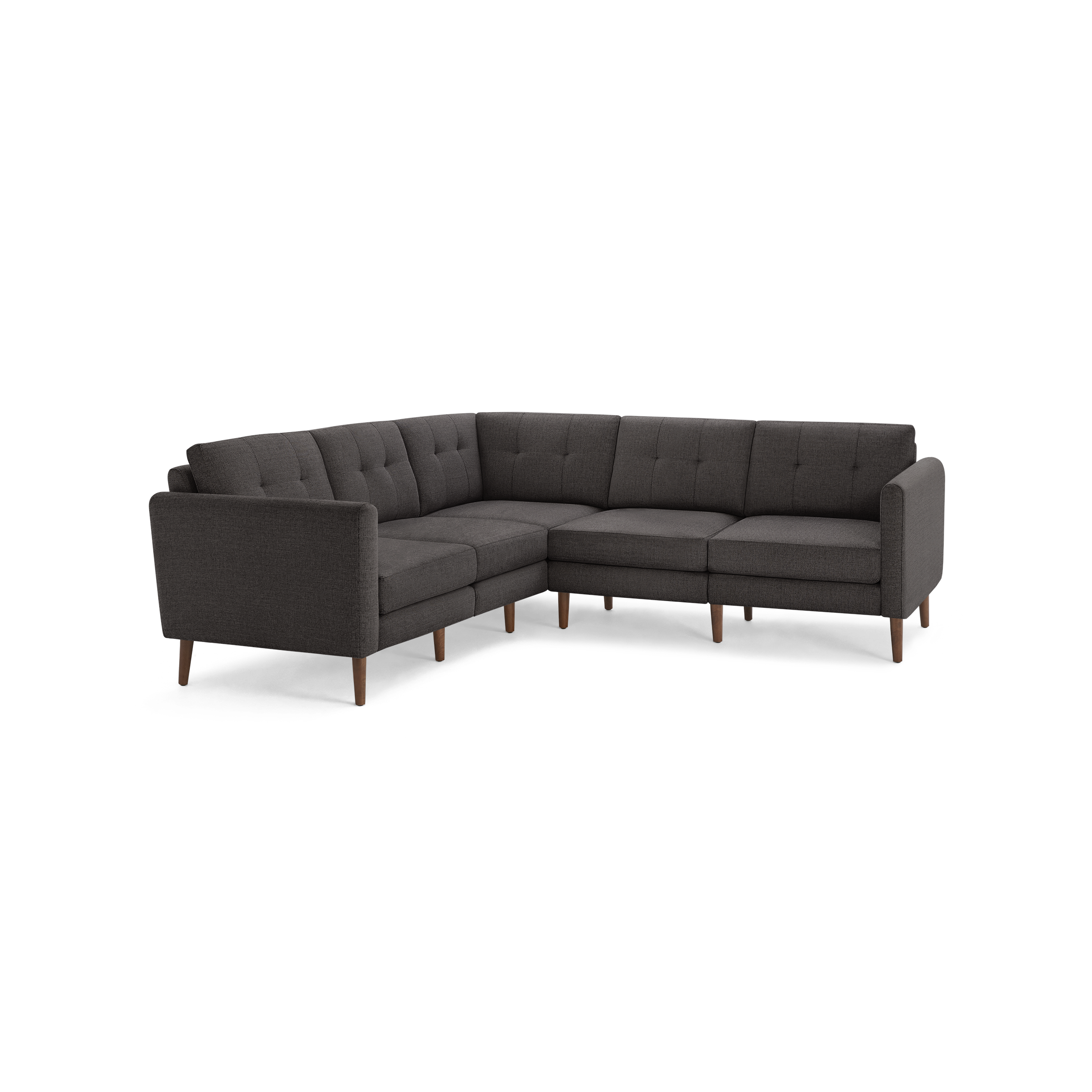 Dark gray L-shaped sectional sofa with tufted cushions and wooden legs, showcasing a modern mid-century design.