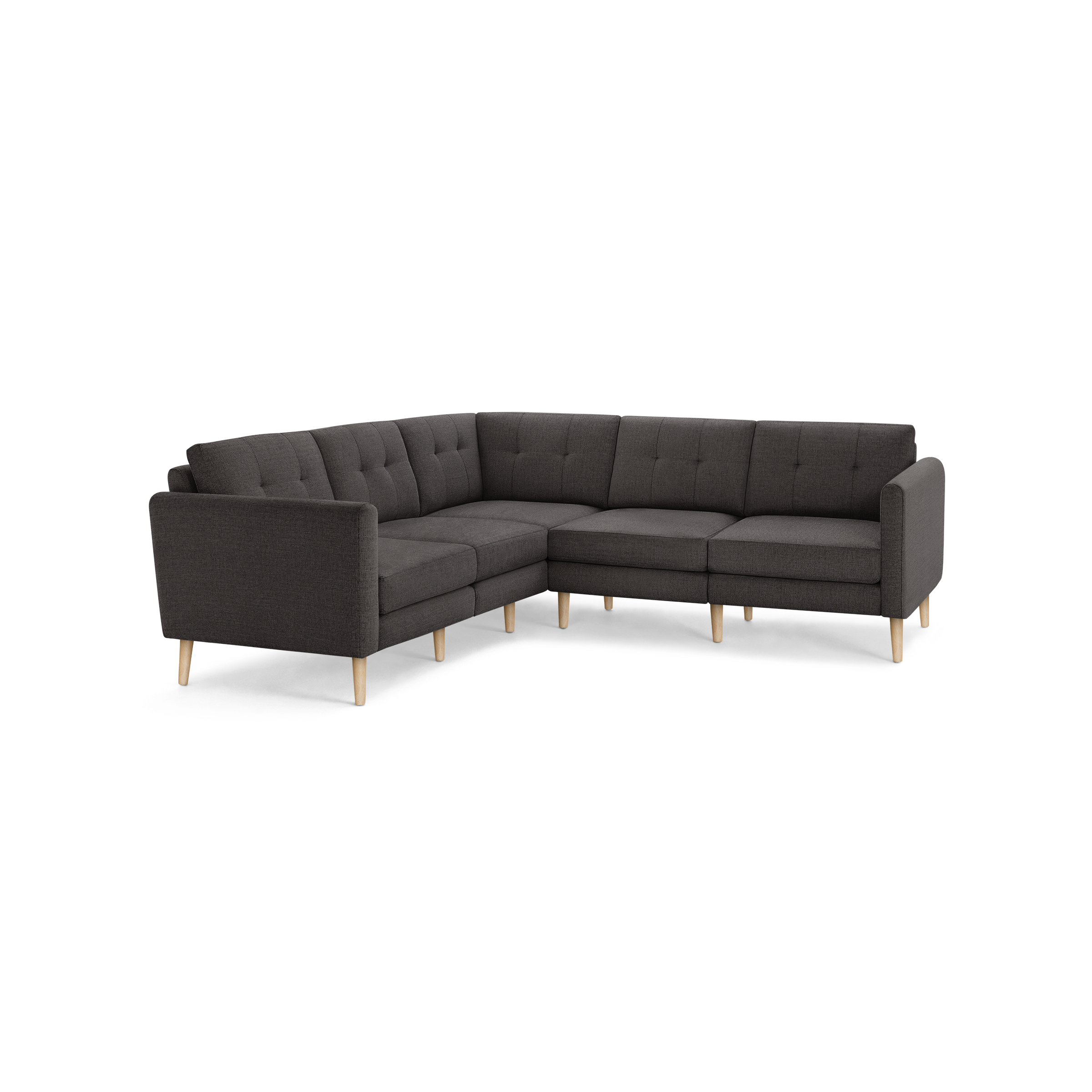 Dark gray fabric L-shaped sectional sofa with button-tufted backrest cushions and light wooden tapered legs.