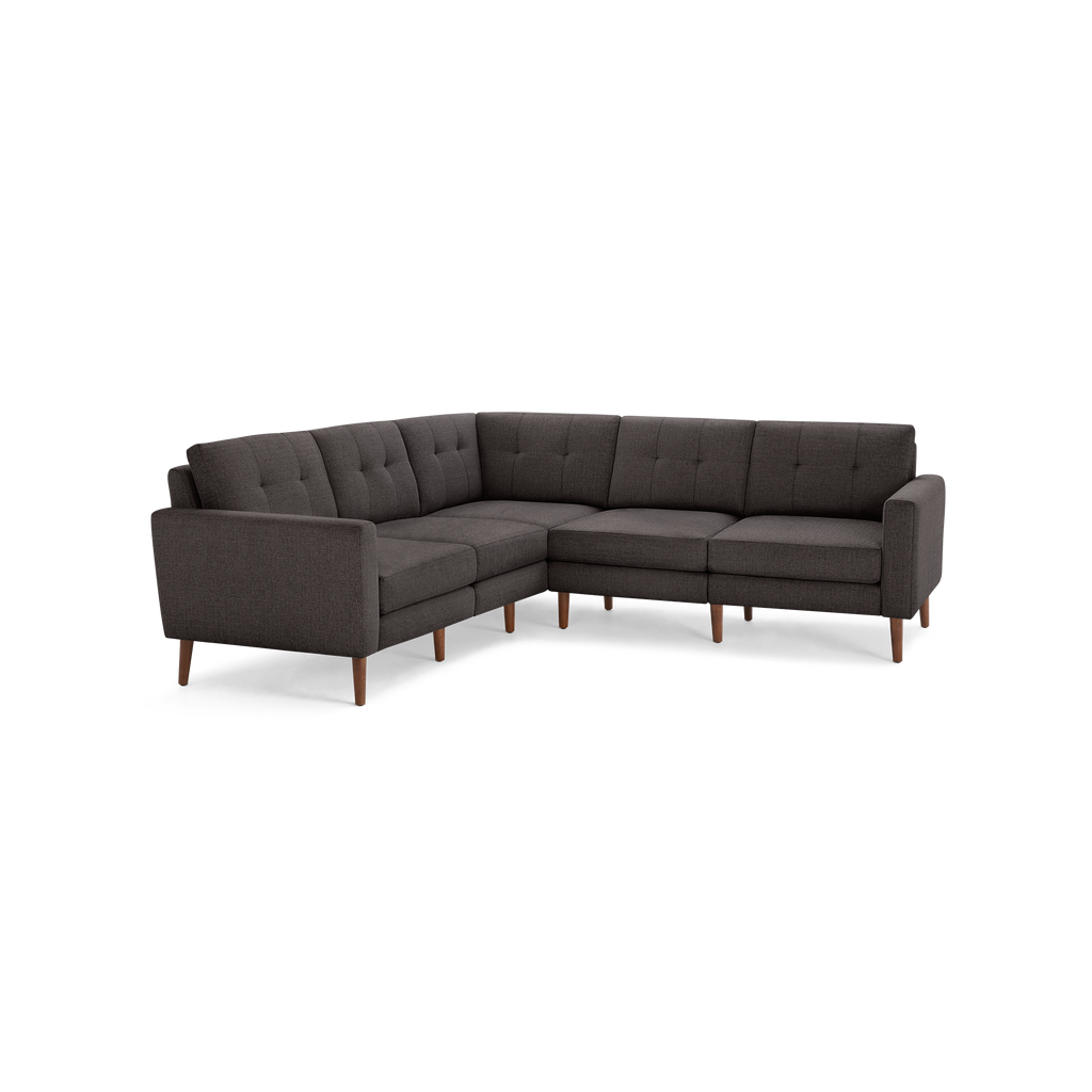 Modern dark gray fabric sectional sofa with tufted back cushions and wooden tapered legs, designed for corner seating.