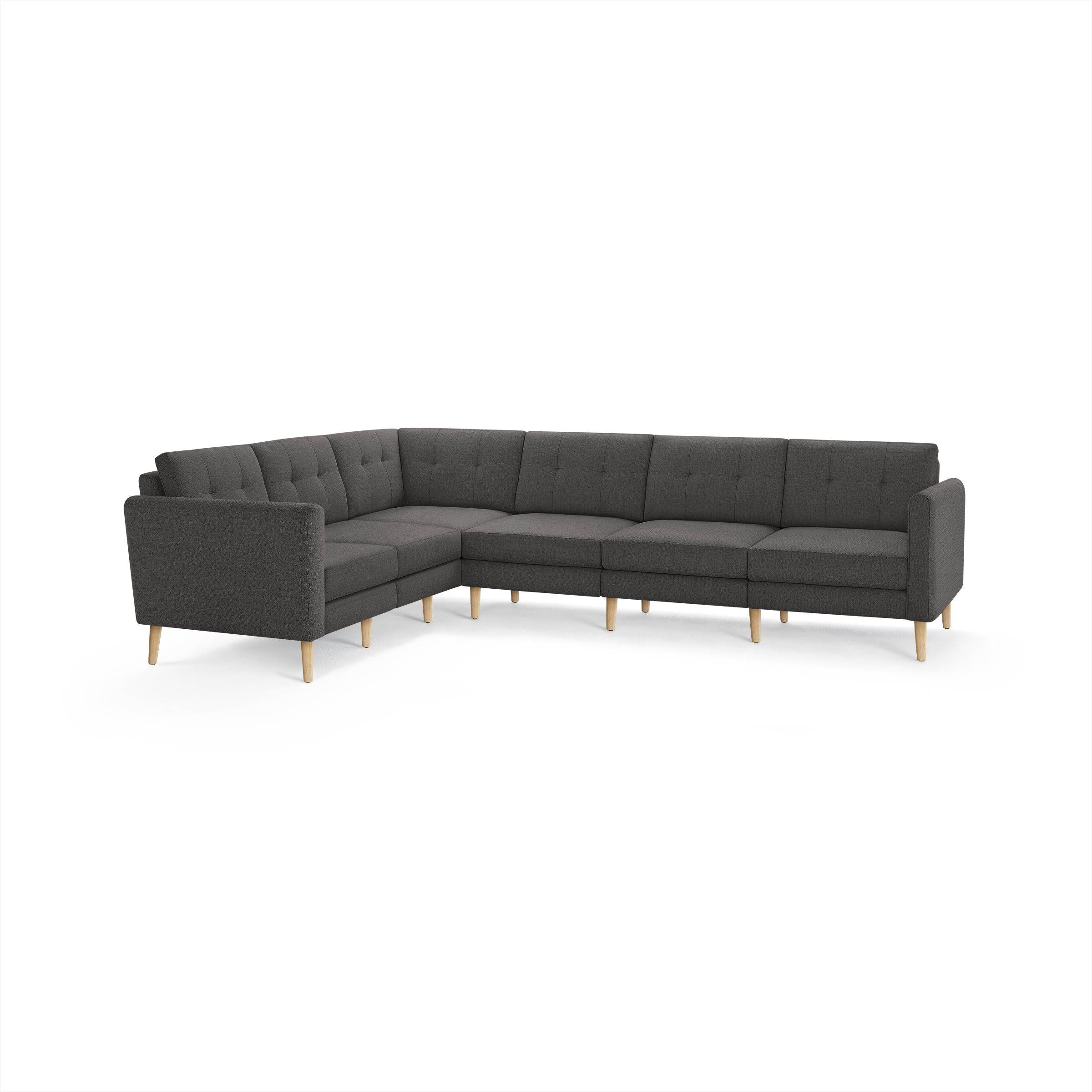 Dark gray L-shaped sectional sofa with tufted cushions and light wooden legs, modern and minimalist design.
