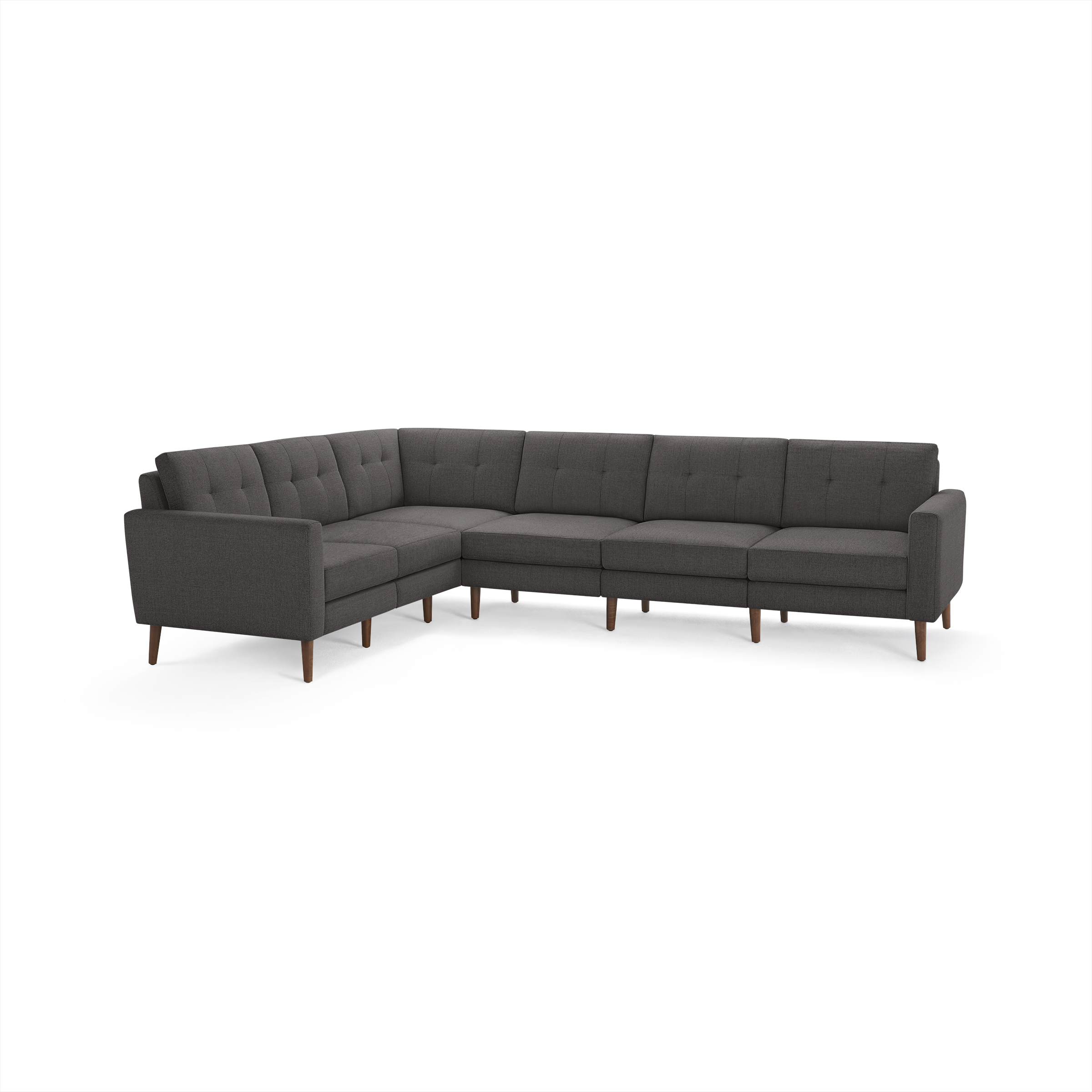 Dark gray fabric sectional sofa with tufted cushions and wooden tapered legs, arranged in an L-shape for spacious seating.