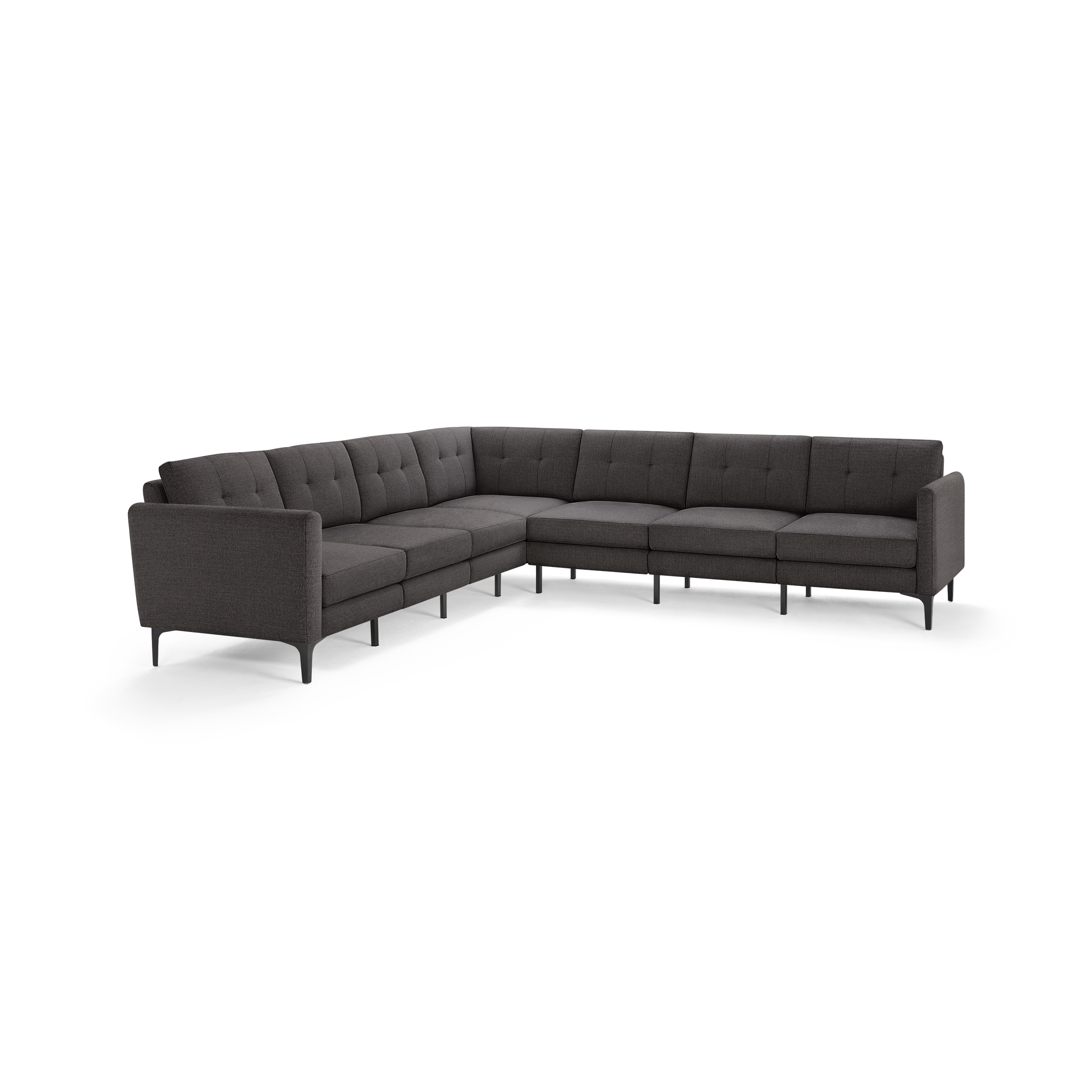 Dark gray L-shaped sectional sofa with tufted cushions and slender black legs, featuring a modern minimalist design.