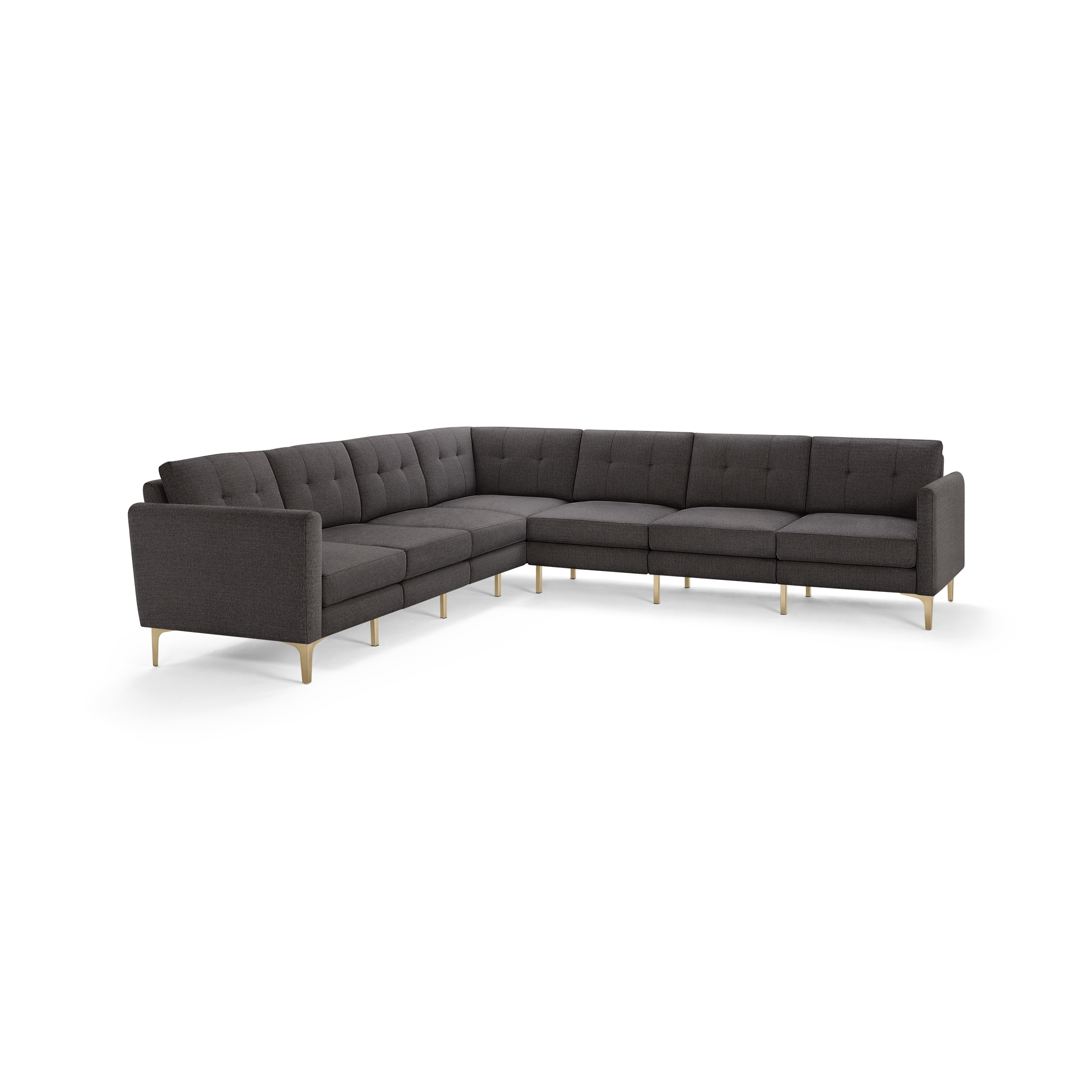 Large modern L-shaped sectional sofa with dark grey tufted fabric upholstery and light wooden legs.
