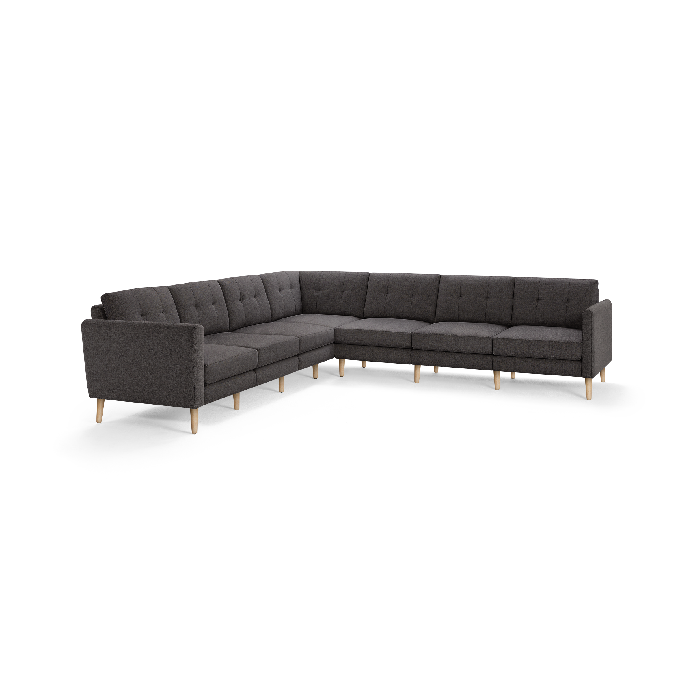 Modern dark gray fabric L-shaped sectional sofa with button-tufted back cushions and light wooden legs.