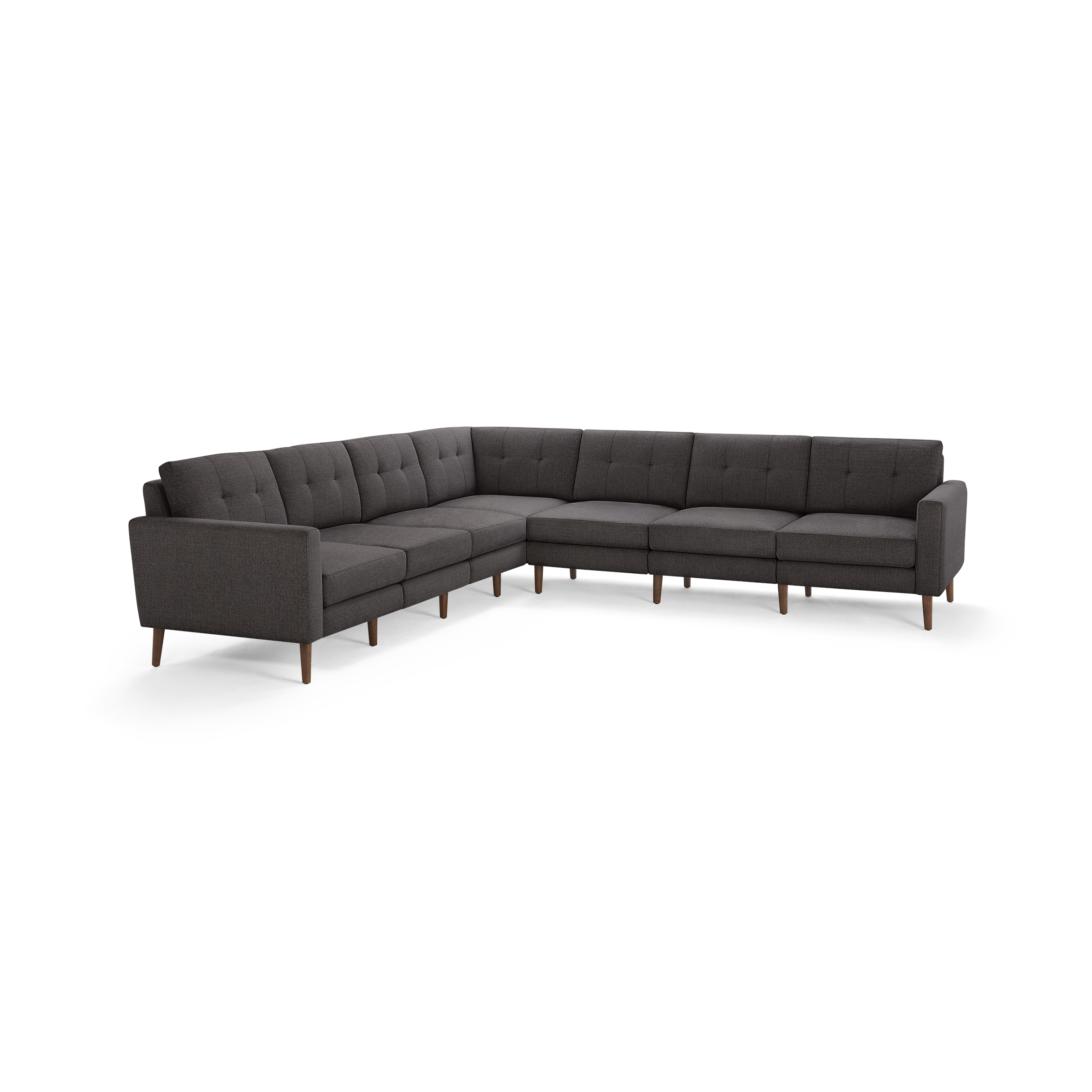 Dark gray fabric L-shaped sectional sofa with tufted back cushions and wooden legs, modern mid-century design.