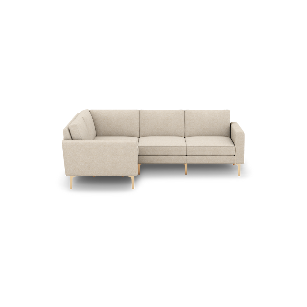 Beige fabric L-shaped sectional sofa with clean lines, cushioned seats, and slim light wooden legs.