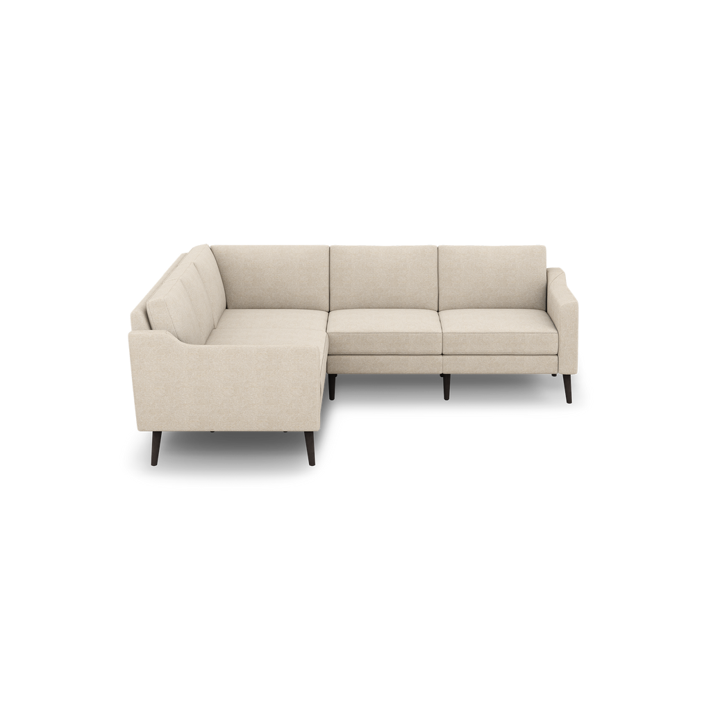Beige fabric L-shaped sectional sofa with tufted back cushions and dark wooden tapered legs, modern and minimalist design.