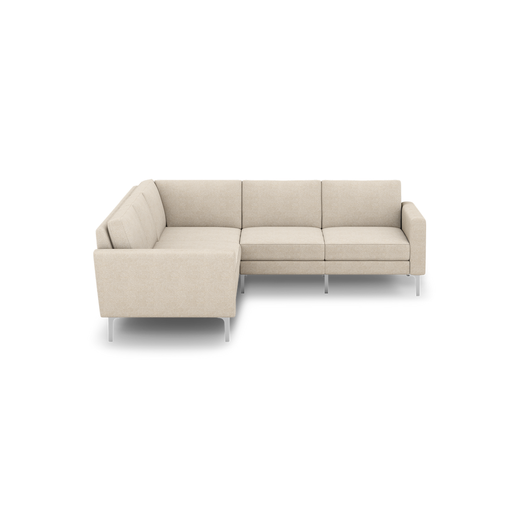 Beige fabric L-shaped sectional sofa with clean lines, cushioned seats, and modern metal legs on a black background.