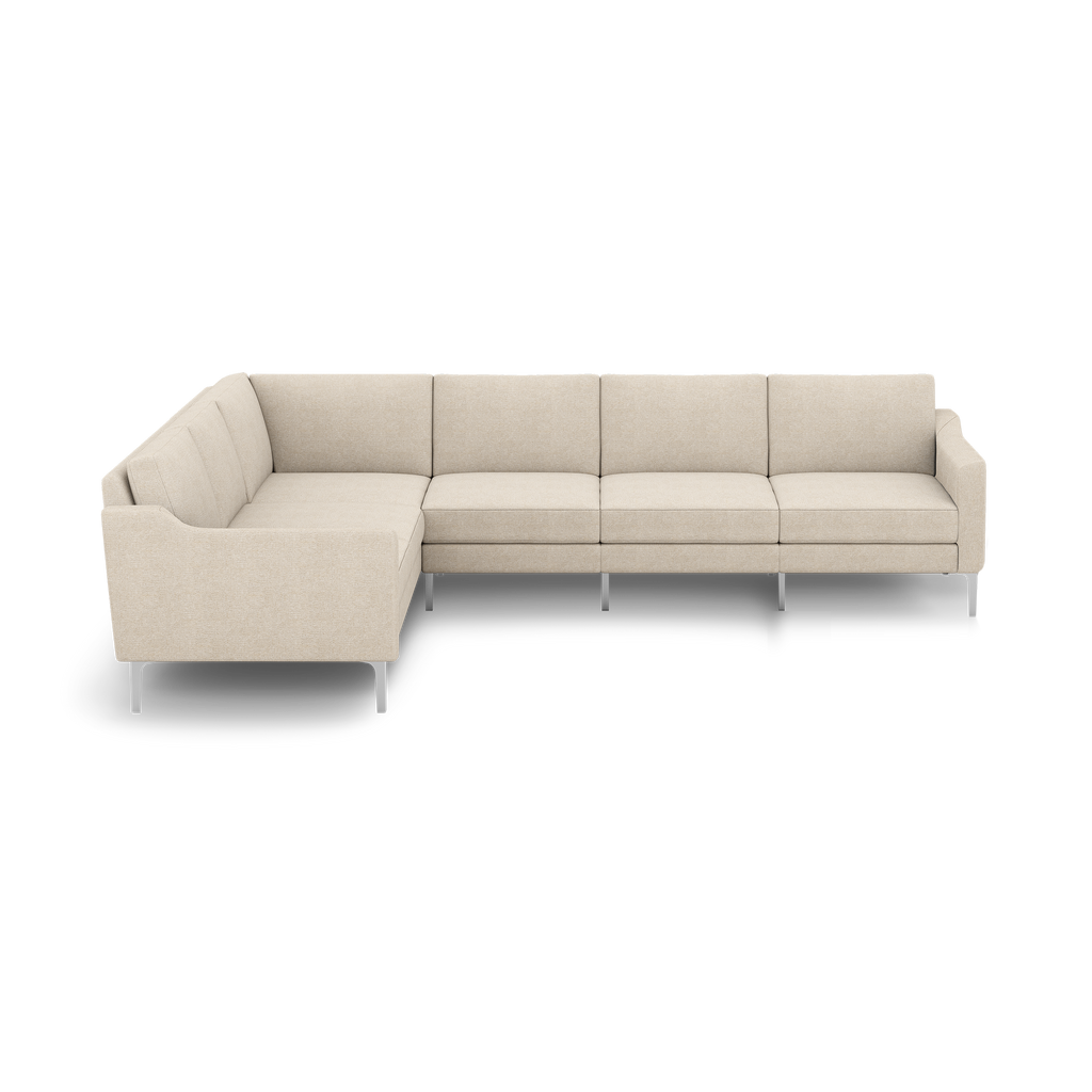Beige L-shaped sectional sofa with modern design, fabric upholstery, cushioned seats, and metal legs against a black background.
