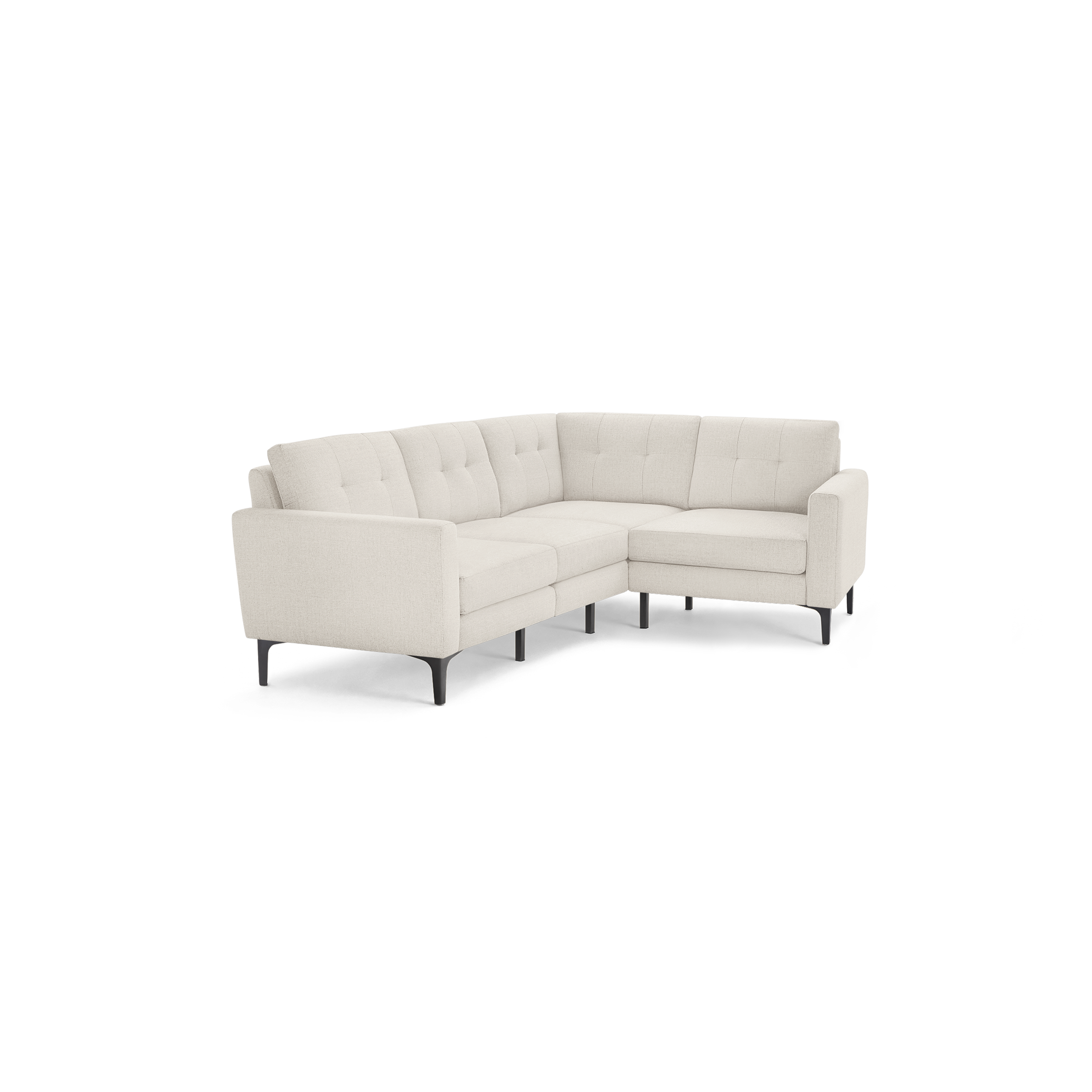 Light beige L-shaped sectional sofa with tufted cushions, slim armrests, and black tapered legs.
